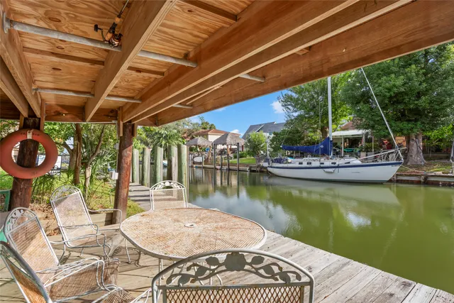 a view of a backyard with sitting area