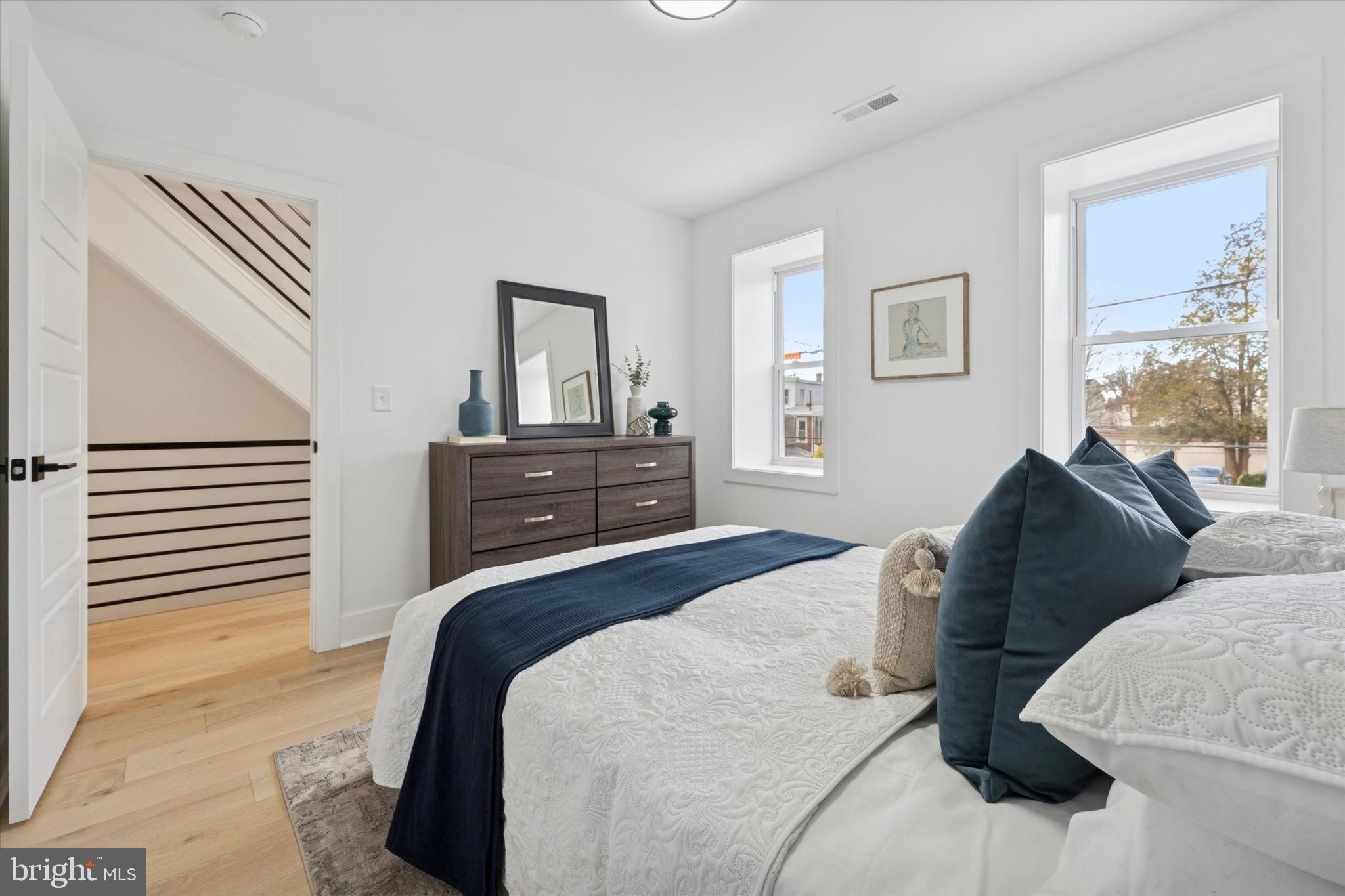 409 Martin Street Philadelphia, PA 19128 - Photo 13 of 20 a bedroom with a bed and a dresser