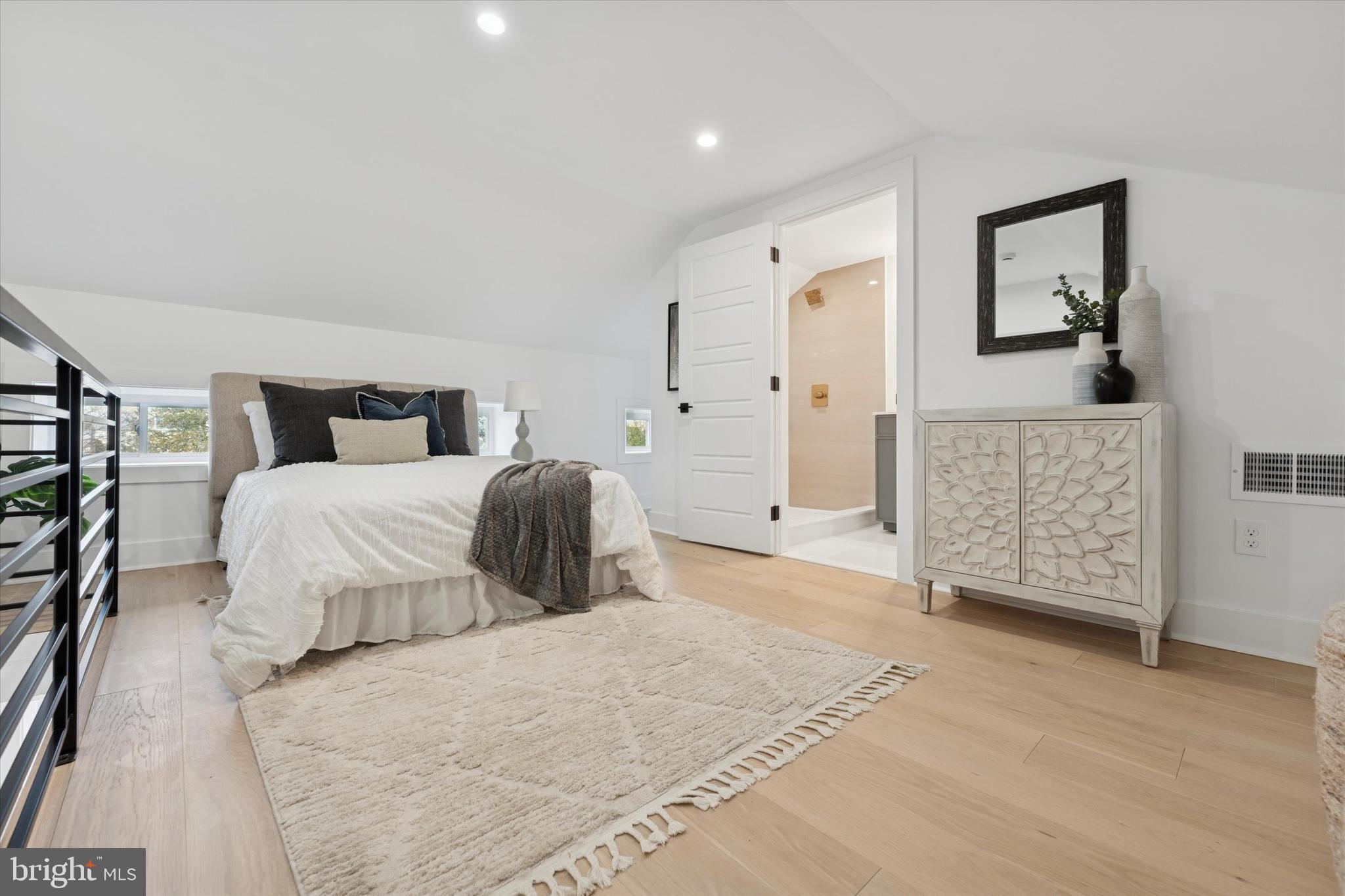 409 Martin Street Philadelphia, PA 19128 - Photo 14 of 20 a bedroom with a bed and a couch