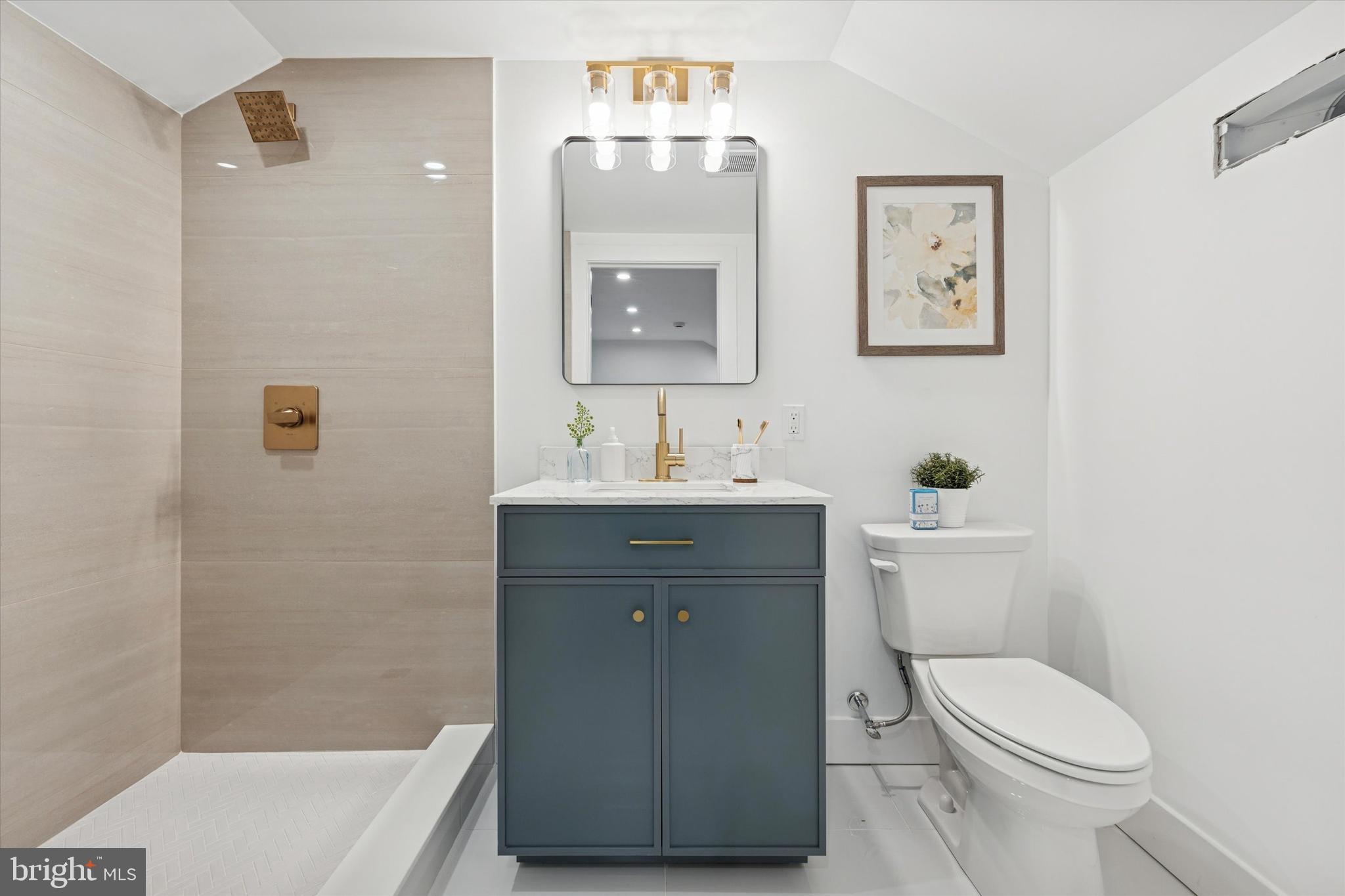 409 Martin Street Philadelphia, PA 19128 - Photo 16 of 20 a bathroom with a sink toilet and vanity