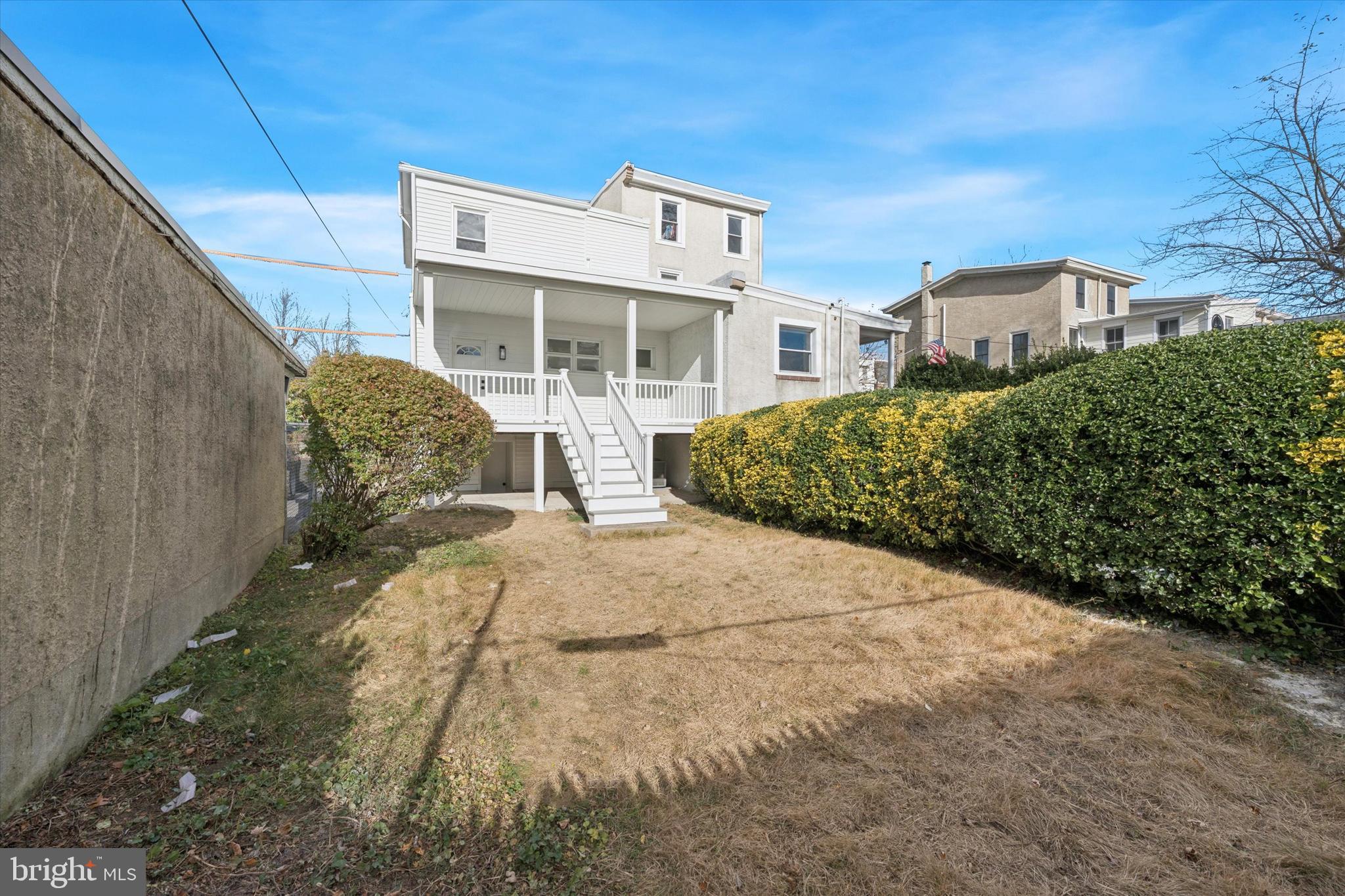 409 Martin Street Philadelphia, PA 19128 - Photo 20 of 20 a front view of a house with a yard