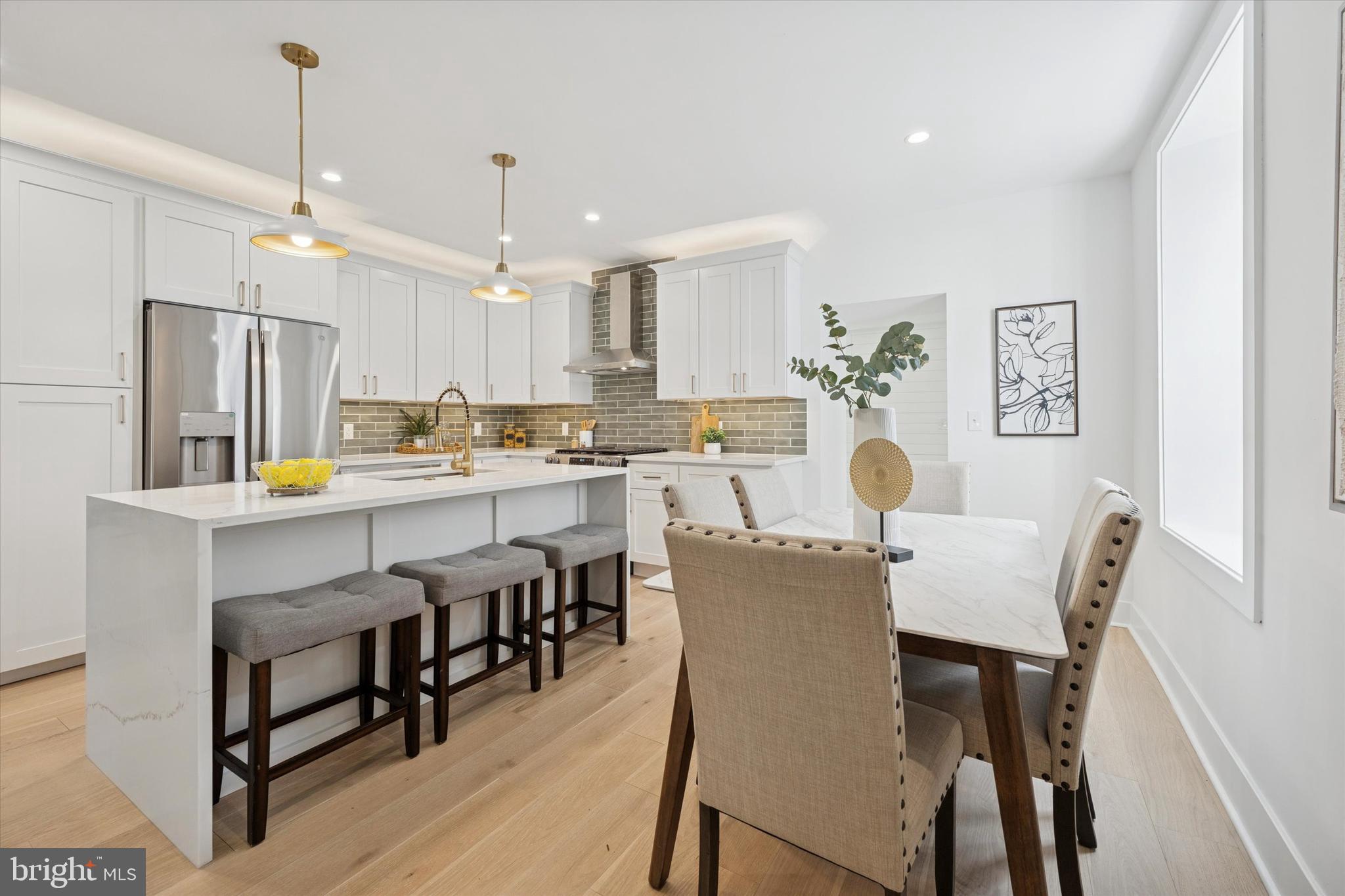 409 Martin Street Philadelphia, PA 19128 - Photo 4 of 20 a view of kitchen with cabinets table and chairs