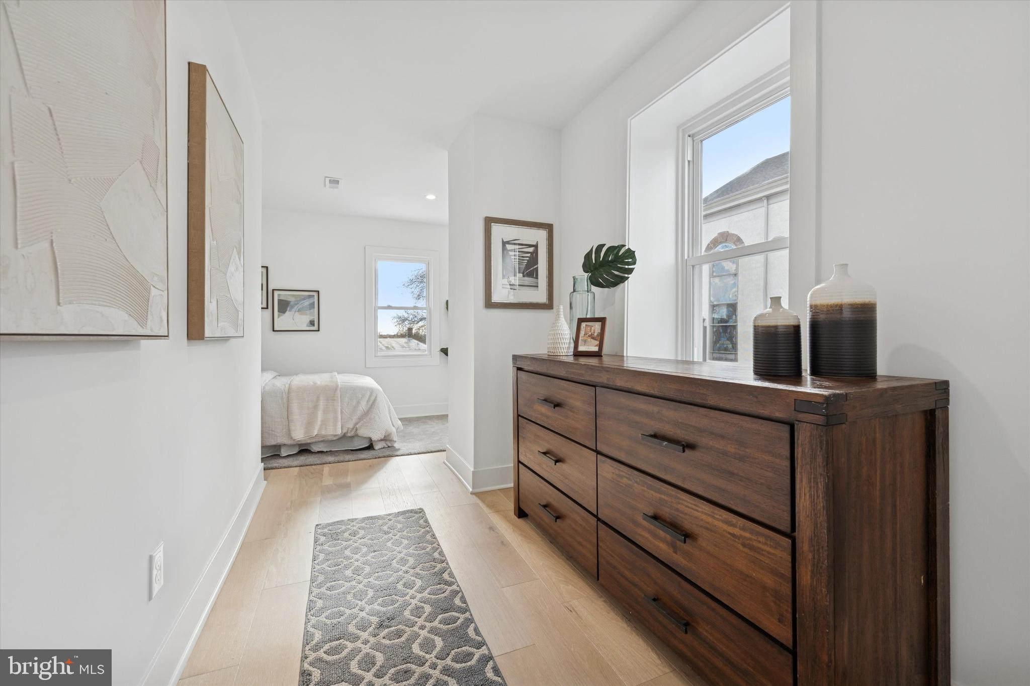 409 Martin Street Philadelphia, PA 19128 - Photo 8 of 20 a room with a bed and a mirror