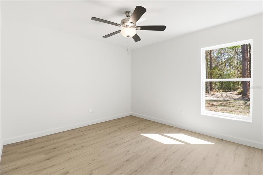 13418 Cormorant Road Weeki Wachee, FL 34614 - Photo 24 of 46 an empty room with a window and a fan