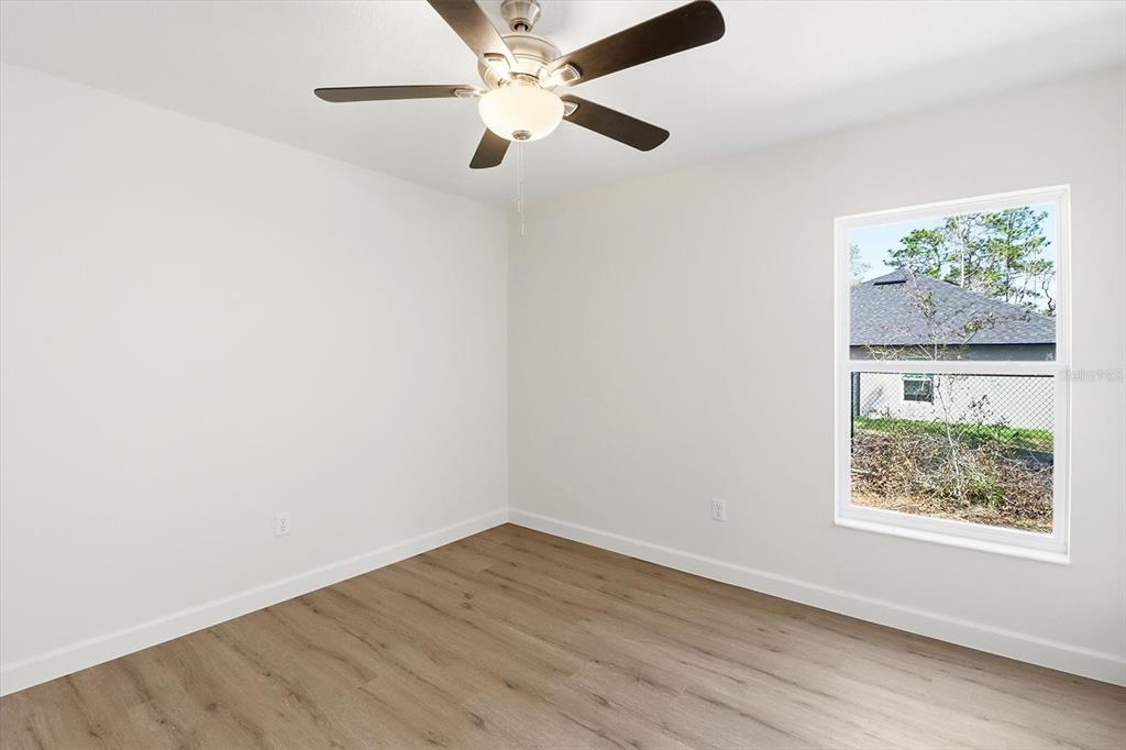 13418 Cormorant Road Weeki Wachee, FL 34614 - Photo 28 of 46 an empty room with a window and a fan