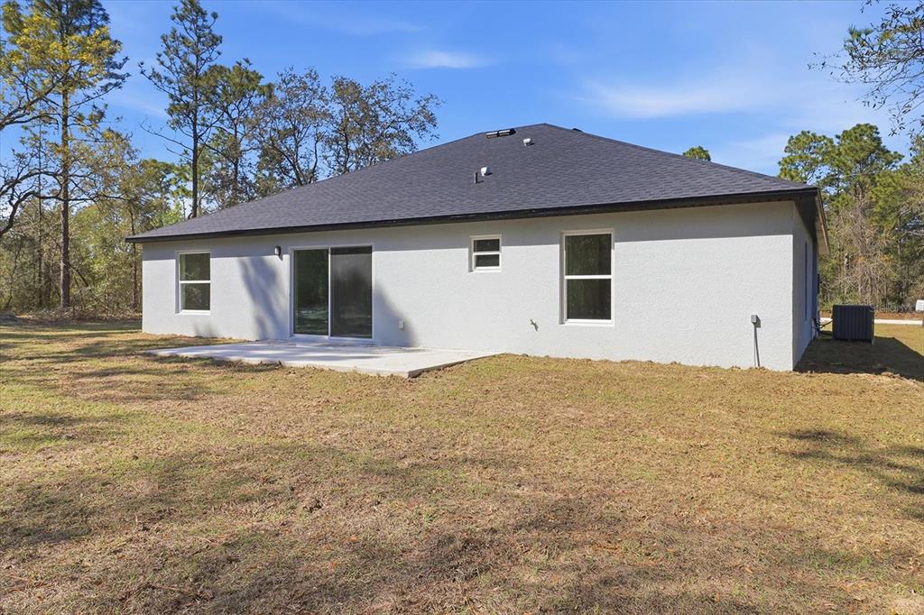 13418 Cormorant Road Weeki Wachee, FL 34614 - Photo 41 of 46 a view of a house with a yard