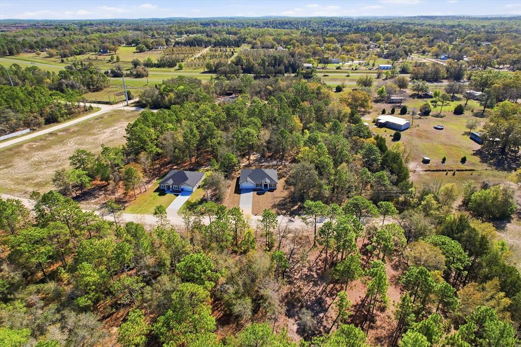 13418 Cormorant Road Weeki Wachee, FL 34614 - Photo 44 of 46 an aerial view of residential houses with outdoor space