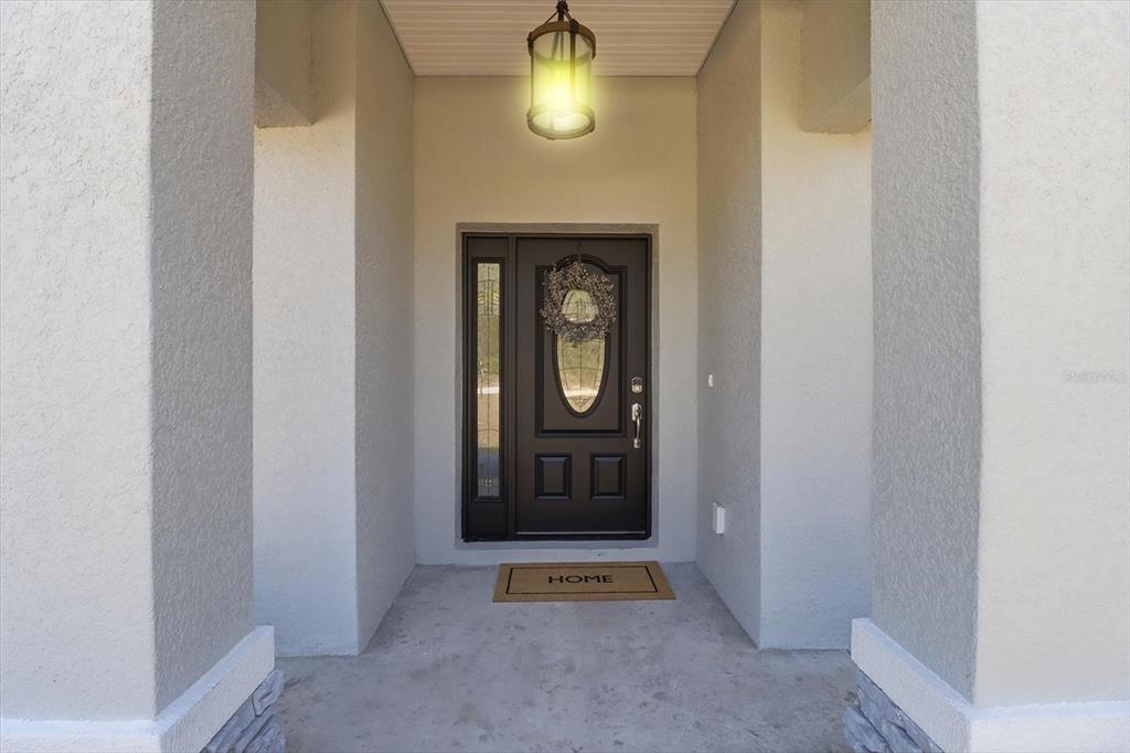 13418 Cormorant Road Weeki Wachee, FL 34614 - Photo 5 of 46 a view of an entryway with wooden floor