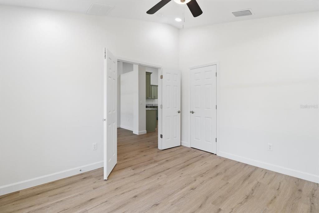 13418 Cormorant Road Weeki Wachee, FL 34614 - Photo 10 of 46 wooden floor in an empty room
