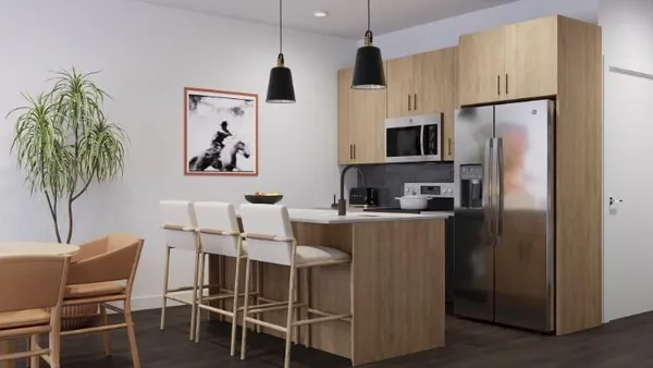 a kitchen with stainless steel appliances kitchen island granite countertop a refrigerator and a table