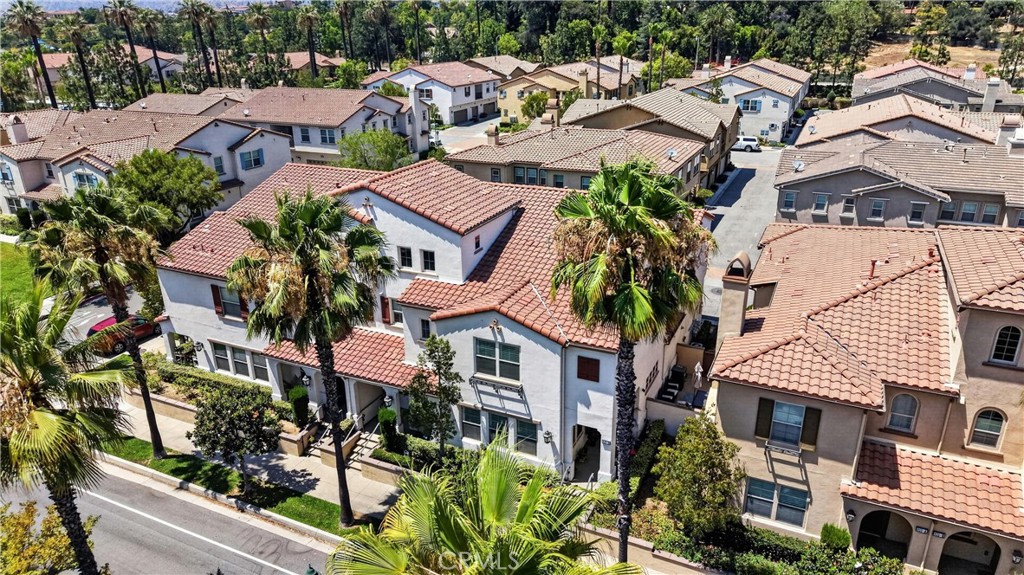 849 The Promenade, Unit D Azusa, CA 91702 - Photo 32 of 37 an aerial view of multiple houses with a yard