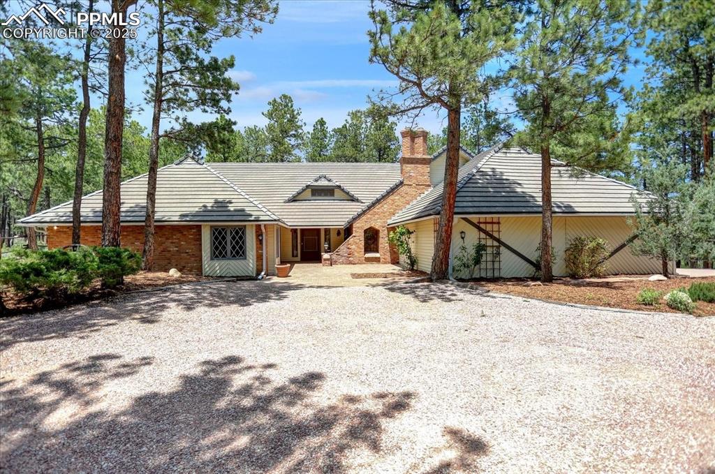 a view of a house with snow on the background