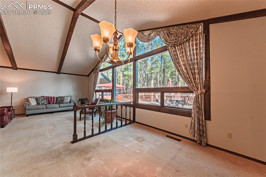 7190 Burgess Road Colorado Springs, CO 80908 - Photo 13 of 50 a view of a hallway with a bike and window