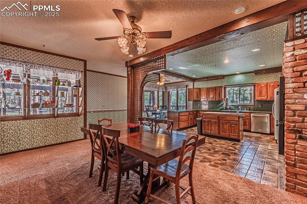 7190 Burgess Road Colorado Springs, CO 80908 - Photo 17 of 50 a view of a dining room with furniture