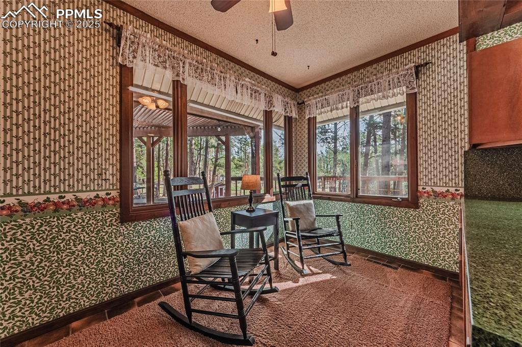 7190 Burgess Road Colorado Springs, CO 80908 - Photo 21 of 50 a view of a patio with a table and chairs