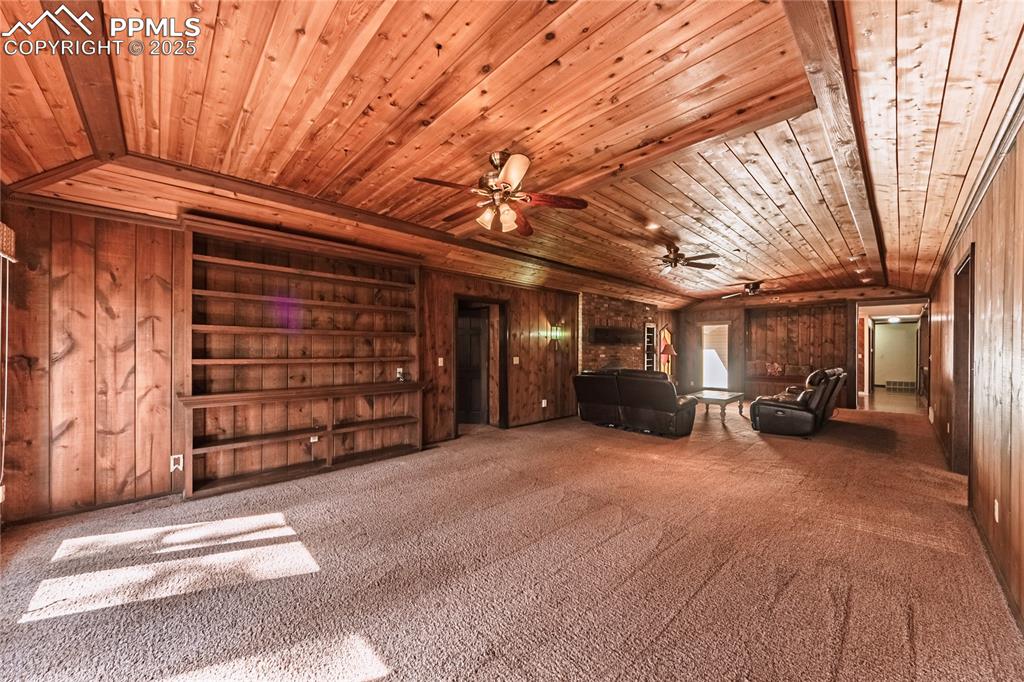 7190 Burgess Road Colorado Springs, CO 80908 - Photo 28 of 50 a view of a big room with furniture and a large window