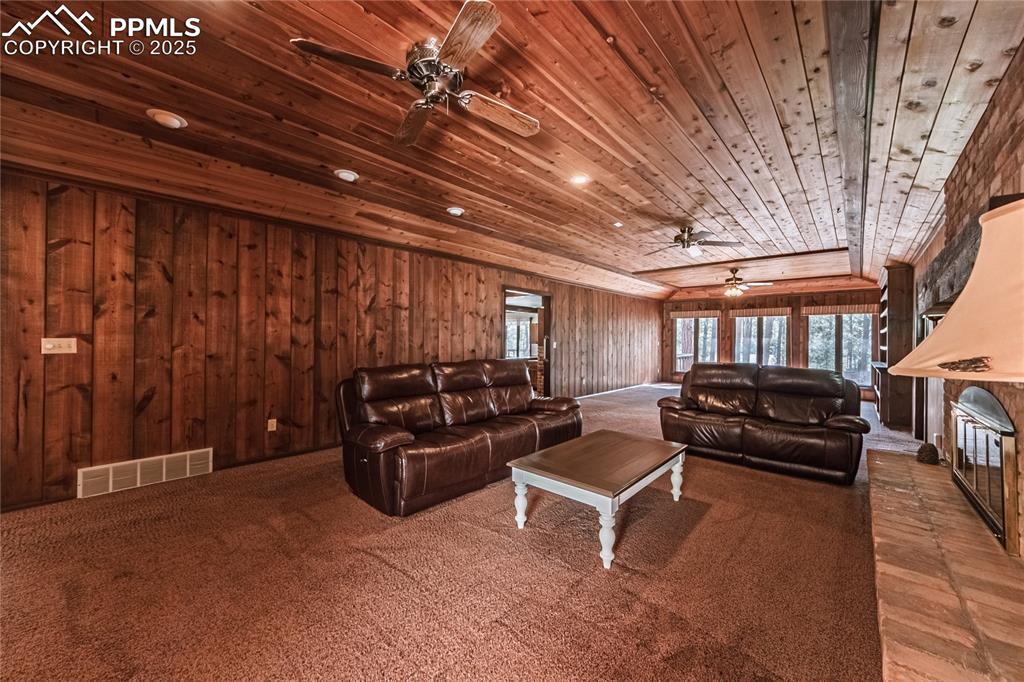 7190 Burgess Road Colorado Springs, CO 80908 - Photo 31 of 50 a living room with furniture and a chandelier