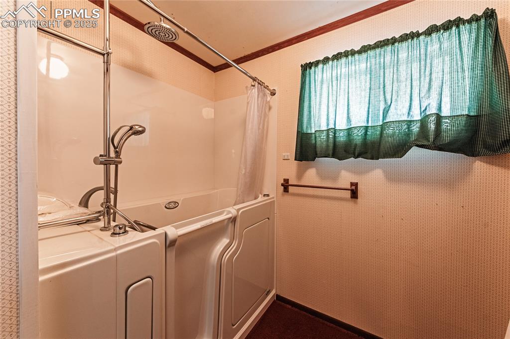 7190 Burgess Road Colorado Springs, CO 80908 - Photo 44 of 50 a bathroom with a sink and a mirror