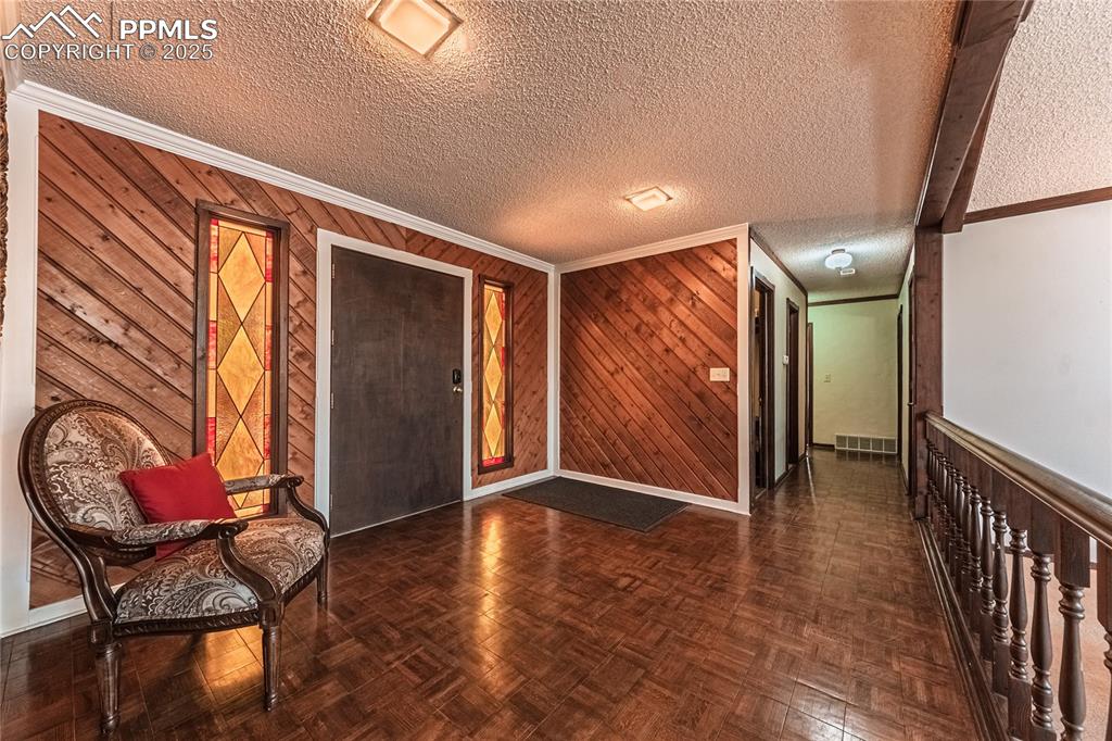 7190 Burgess Road Colorado Springs, CO 80908 - Photo 7 of 50 a view of entryway with hardwood