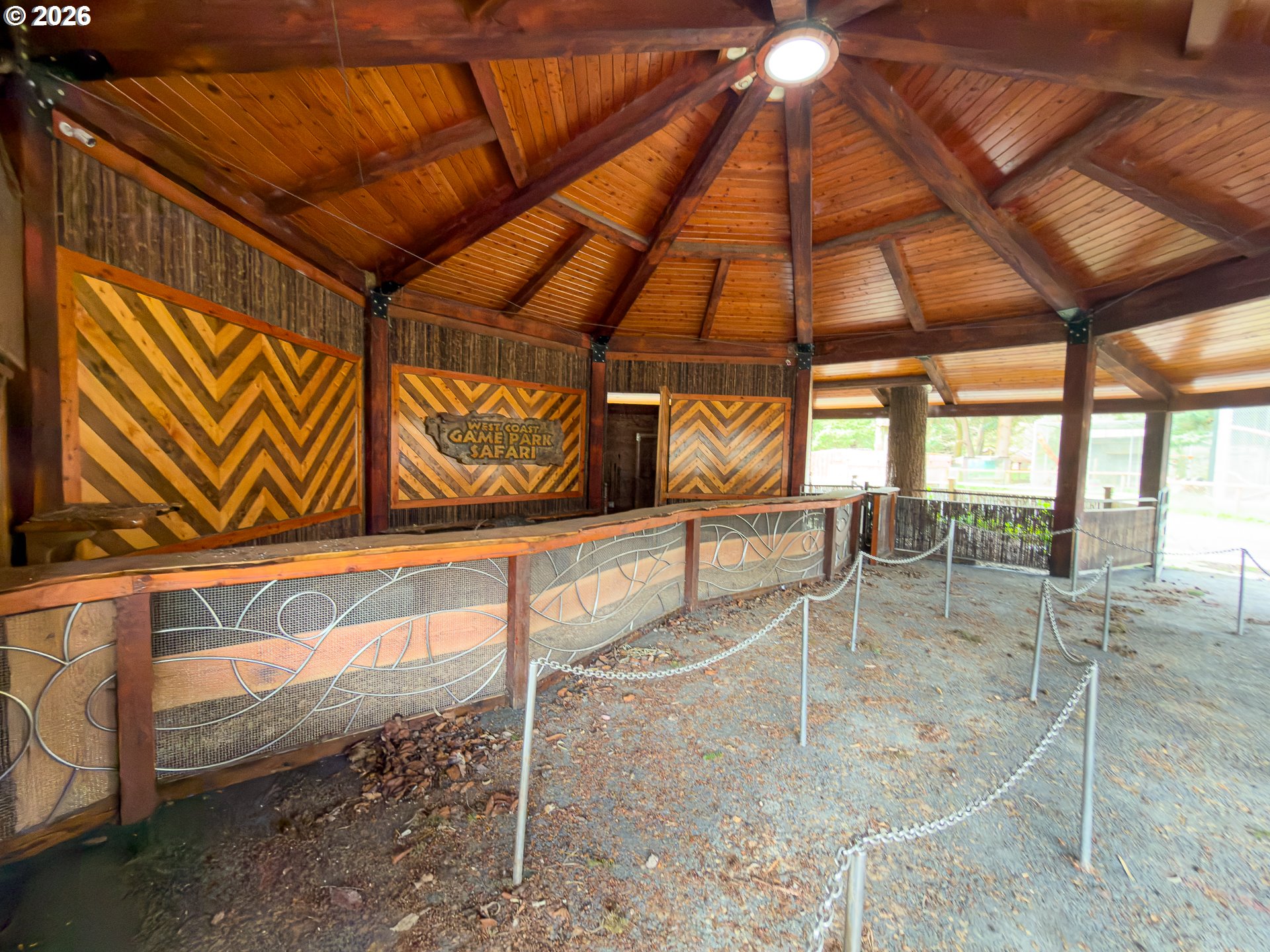 46914 Highway 101 Bandon, OR 97411 - Photo 13 of 48 a room with lots of windows and ceiling fan
