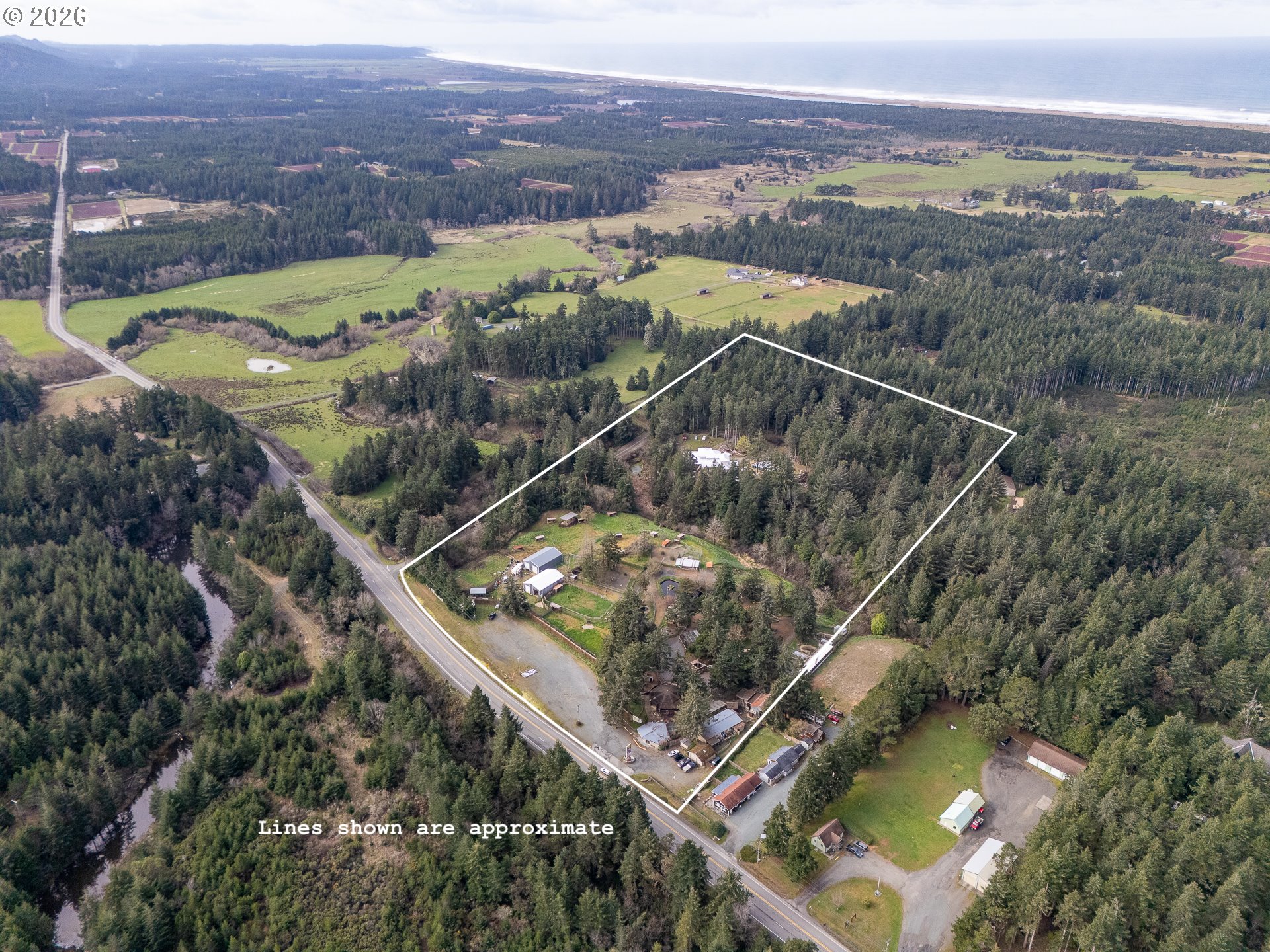 46914 Highway 101 Bandon, OR 97411 - Photo 2 of 48 an aerial view of houses with yard