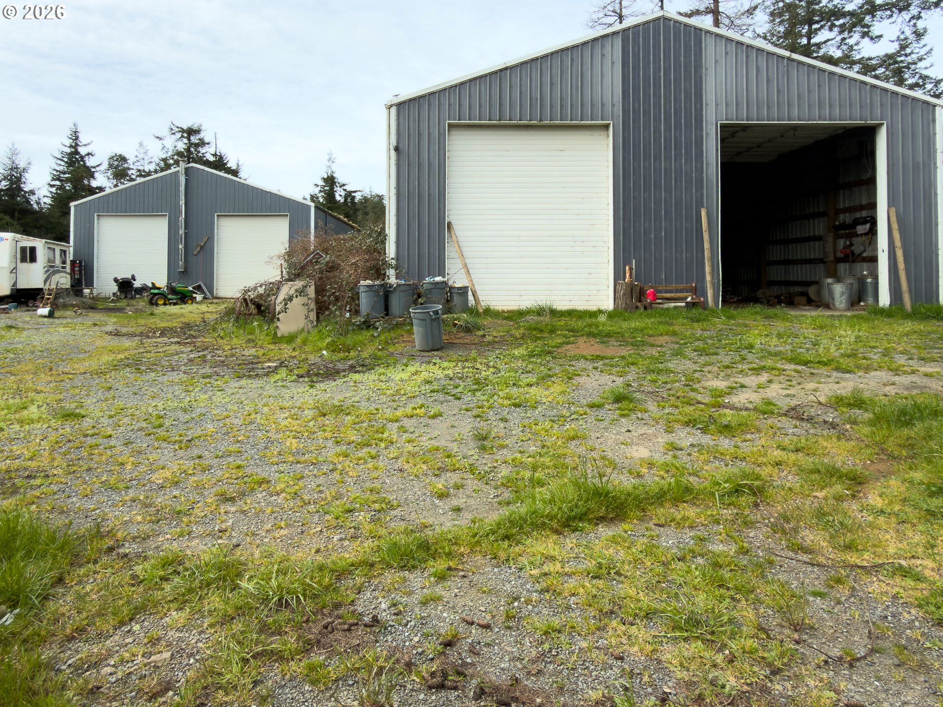 46914 Highway 101 Bandon, OR 97411 - Photo 29 of 48 a front view of a house with garden