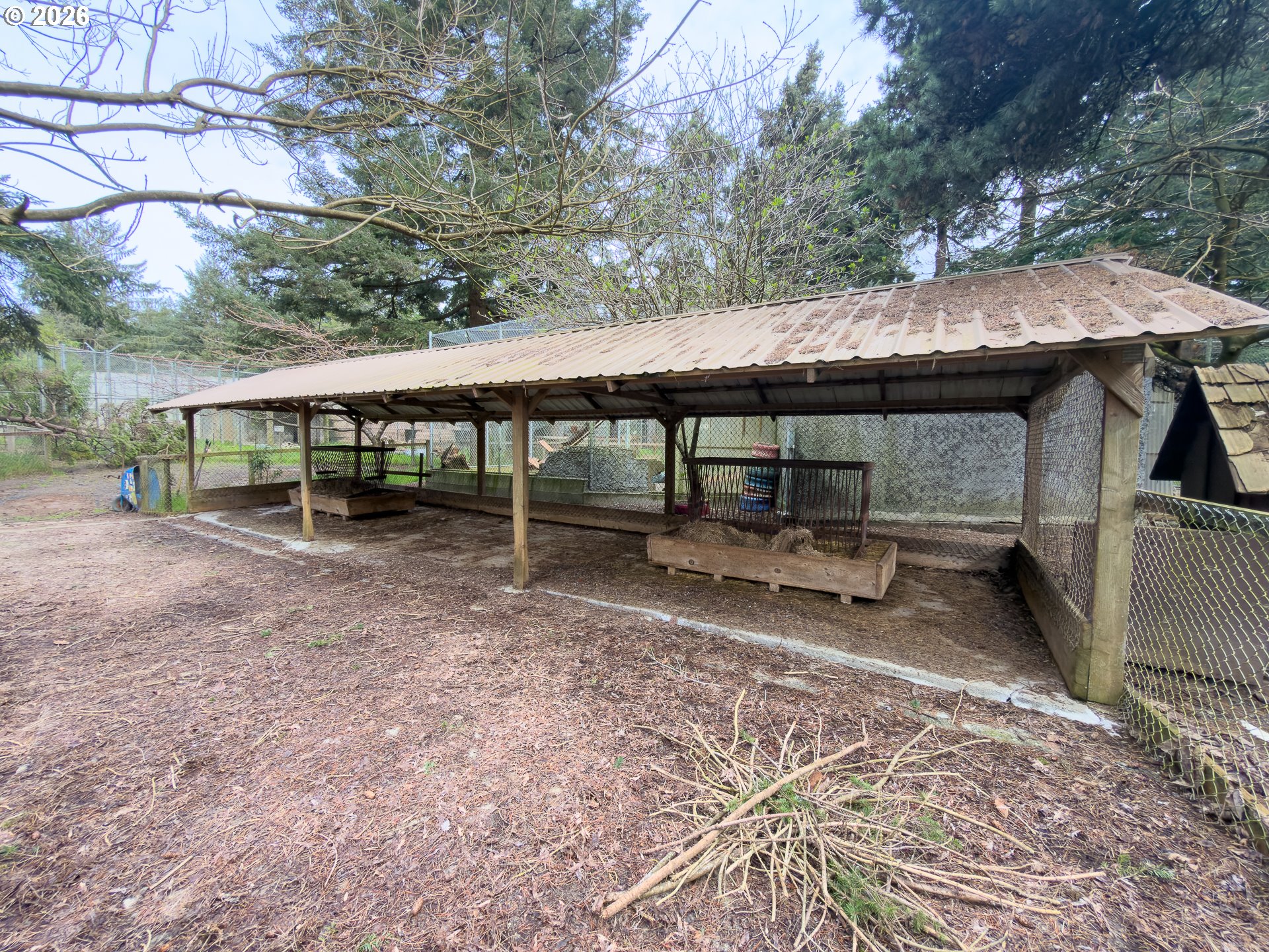 46914 Highway 101 Bandon, OR 97411 - Photo 31 of 48 a backyard of a house with barbeque oven table and chairs