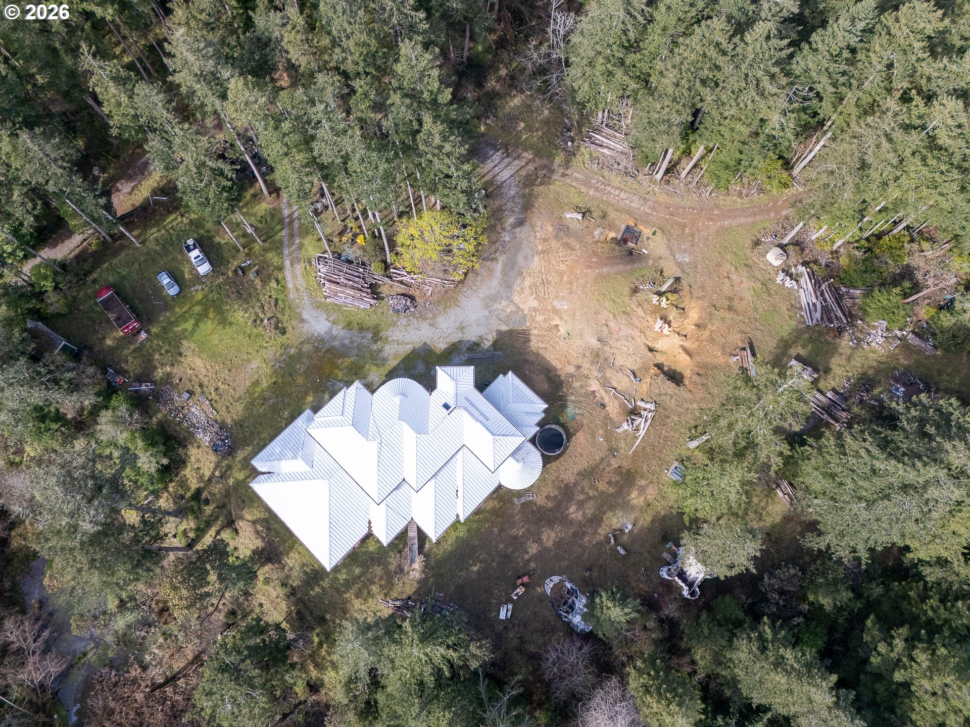 46914 Highway 101 Bandon, OR 97411 - Photo 35 of 48 an aerial view of a house with a yard