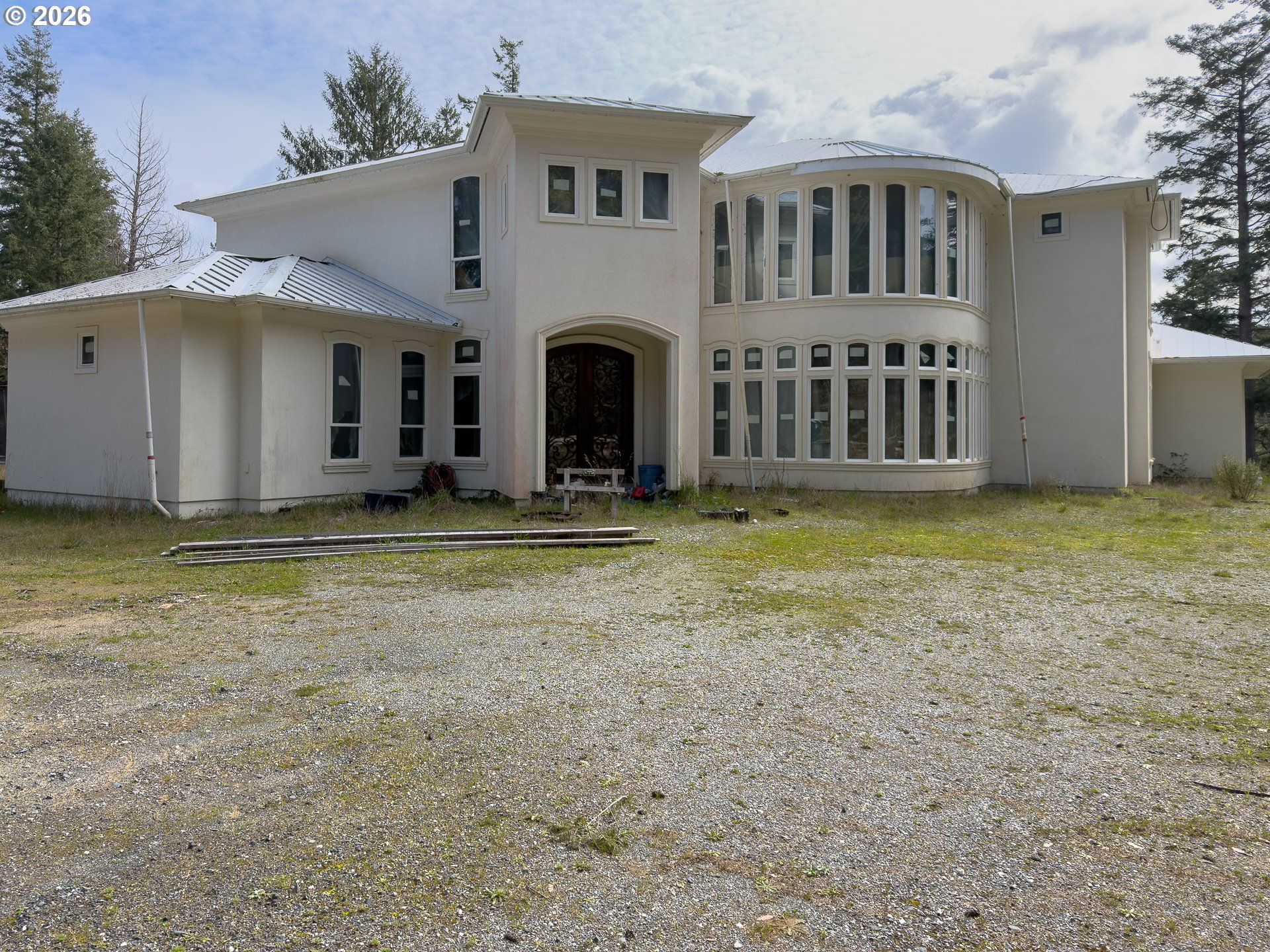 46914 Highway 101 Bandon, OR 97411 - Photo 38 of 48 a view of house with yard and swimming pool