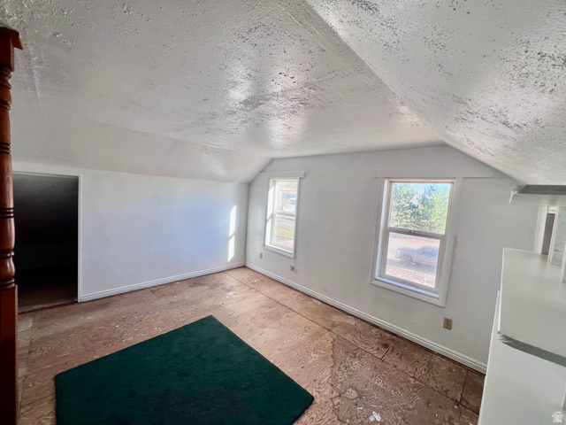 479 East 100 N Road Meadow, UT 84644 - Photo 23 of 59 Bonus room featuring baseboards and a textured ceiling