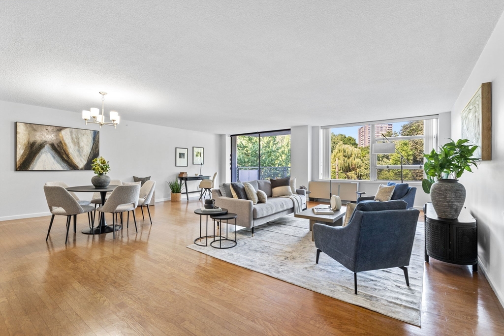 80 Park Street, Unit 23 Brookline, MA 02446 - Photo 1 of 38 a living room with furniture and a large window