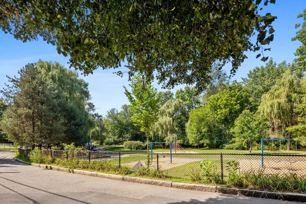 80 Park Street, Unit 23 Brookline, MA 02446 - Photo 37 of 38 a view of a swimming pool and a yard