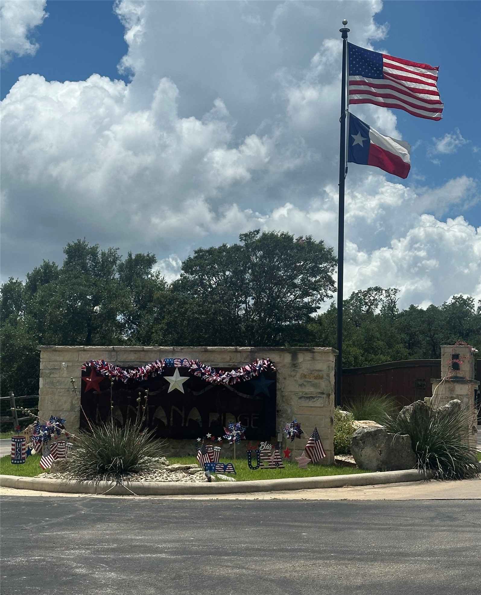 0 Lantana Gold Spring Branch, TX 78070 - Photo 15 of 15 An inviting stone-faced entrance with natural landscaping defines this community's welcoming curb appeal.