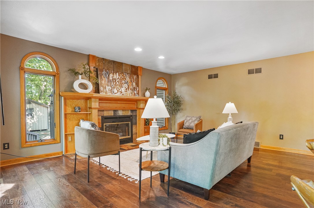 370 Wilcox Road Youngstown, OH 44515 - Photo 13 of 49 Living room featuring a tiled fireplace, recessed lighting, and hardwood / wood-style flooring