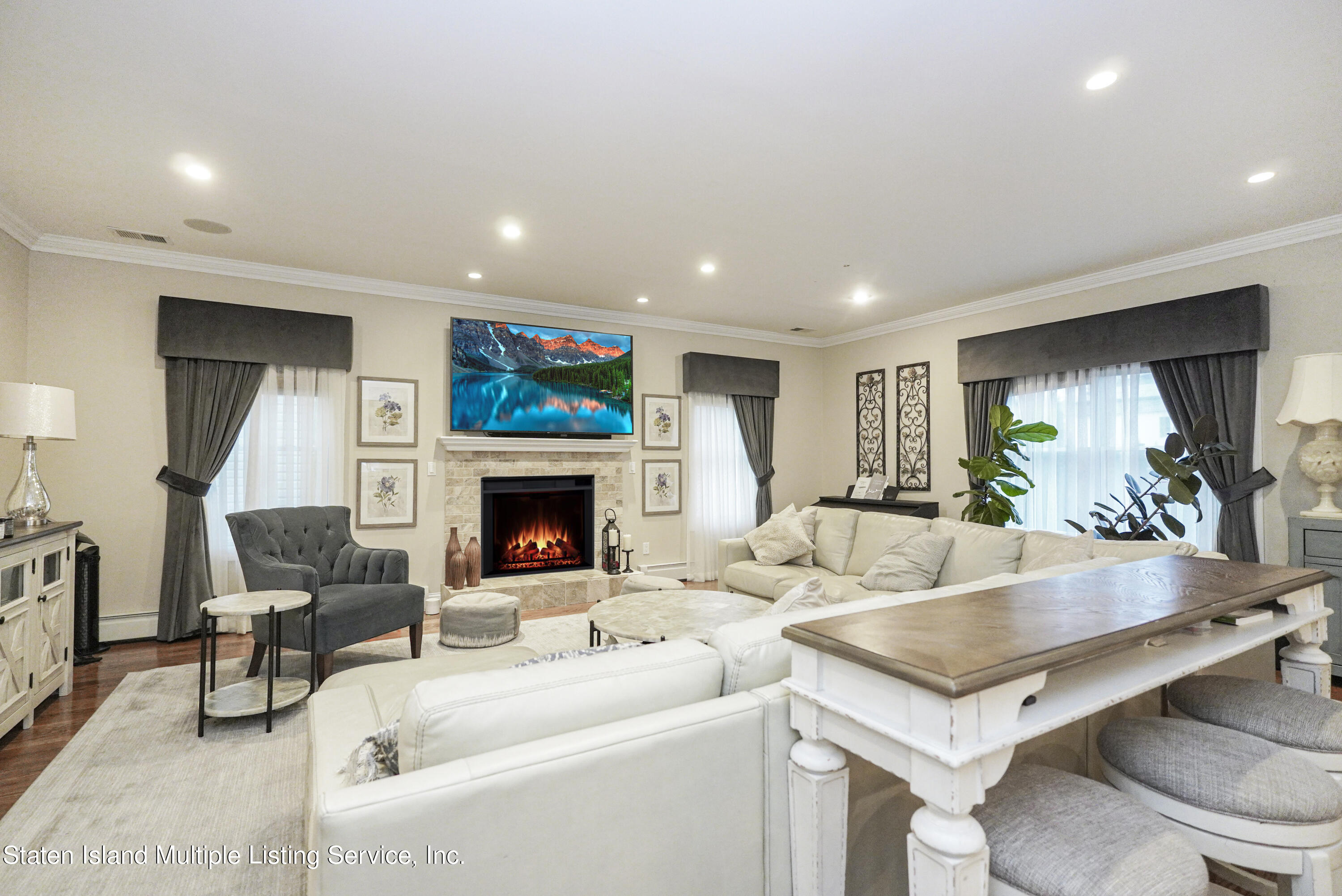 20 Kenneth Place Staten Island, NY 10309 - Photo 13 of 52 a living room with furniture and a fireplace
