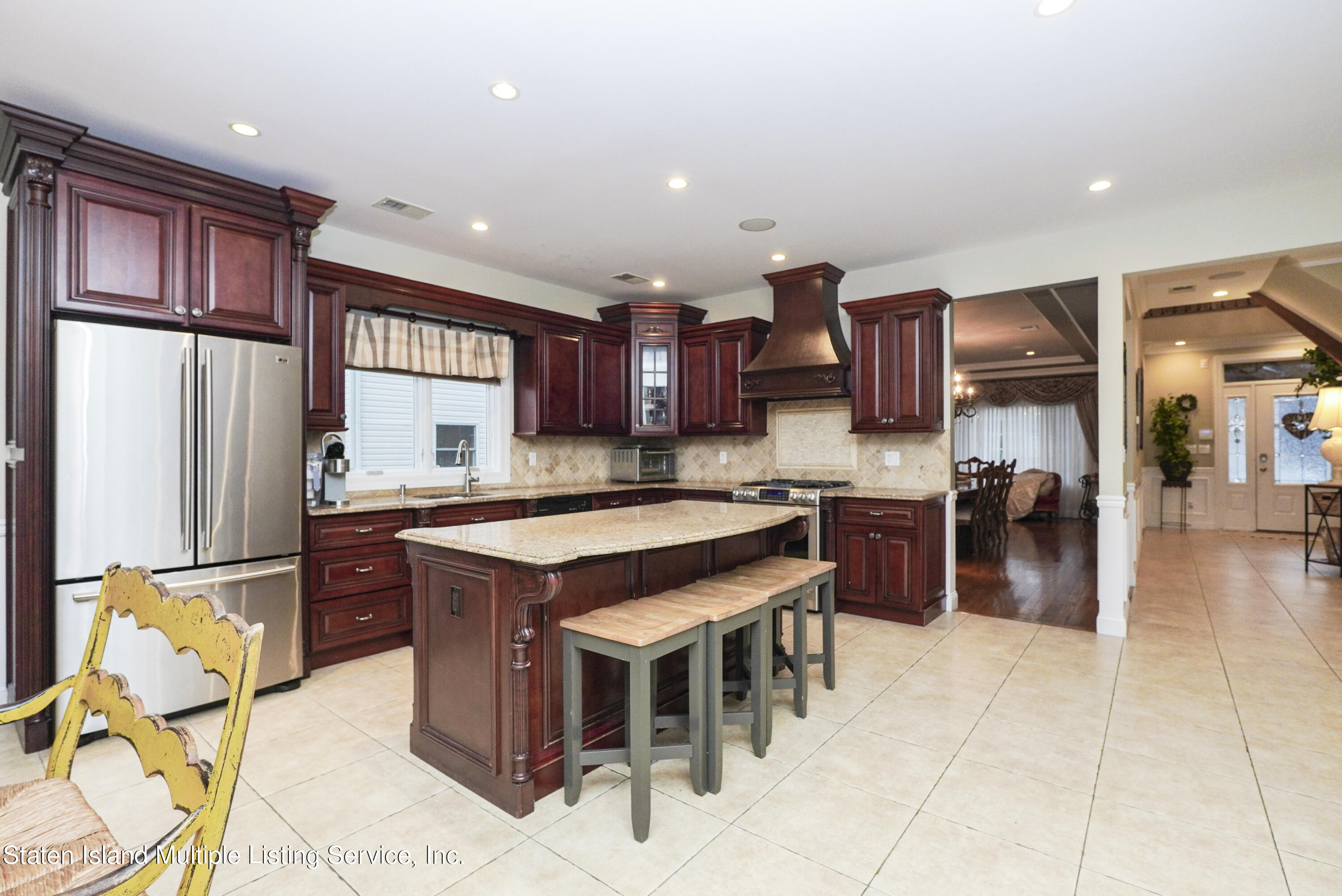 20 Kenneth Place Staten Island, NY 10309 - Photo 19 of 52 a kitchen with stainless steel appliances granite countertop a stove refrigerator and a sink