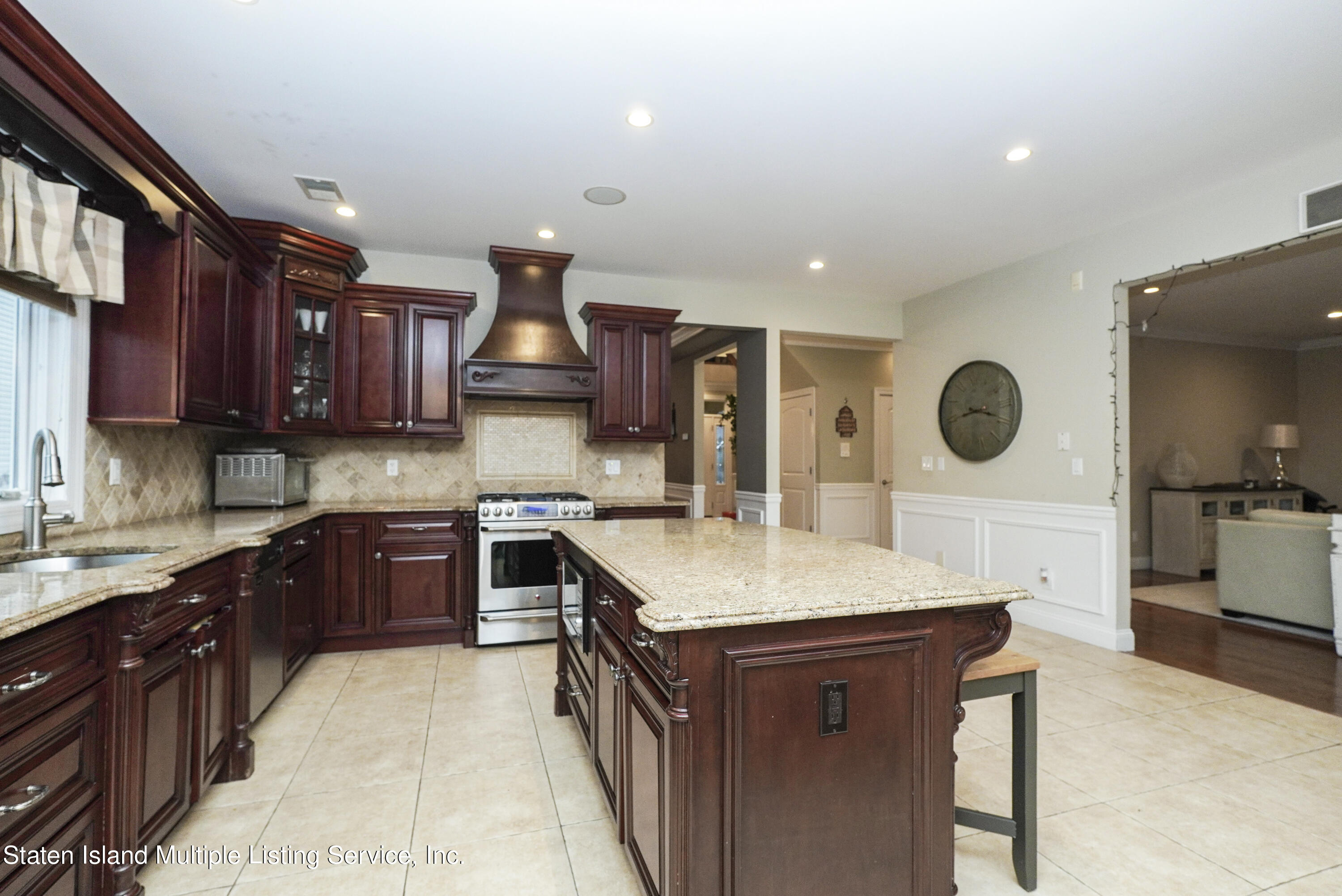 20 Kenneth Place Staten Island, NY 10309 - Photo 20 of 52 a kitchen with a stove a sink and a refrigerator