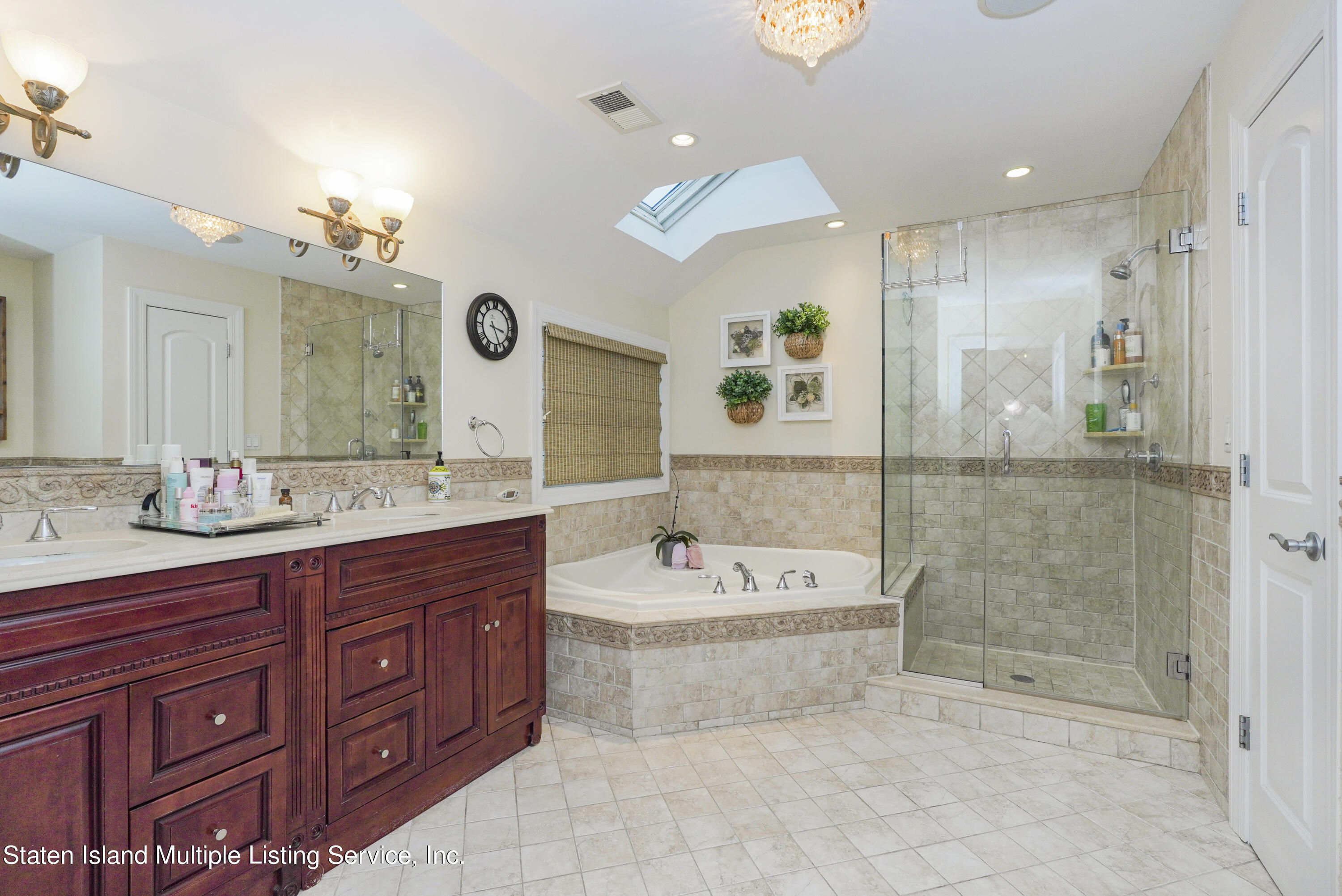 20 Kenneth Place Staten Island, NY 10309 - Photo 29 of 52 a spacious bathroom with a tub sink shower and mirror