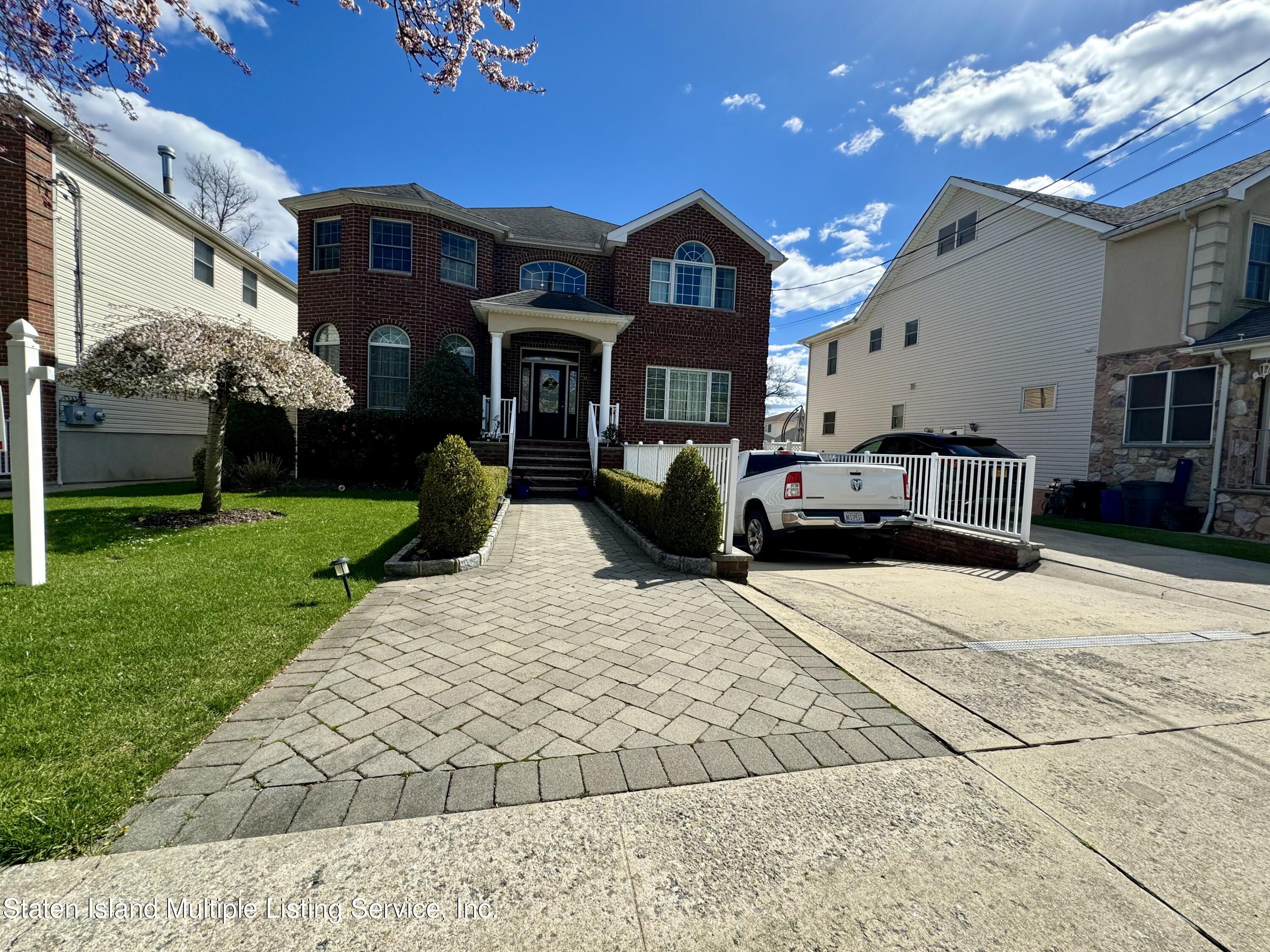 20 Kenneth Place Staten Island, NY 10309 - Photo 3 of 52 a front view of a house with a yard