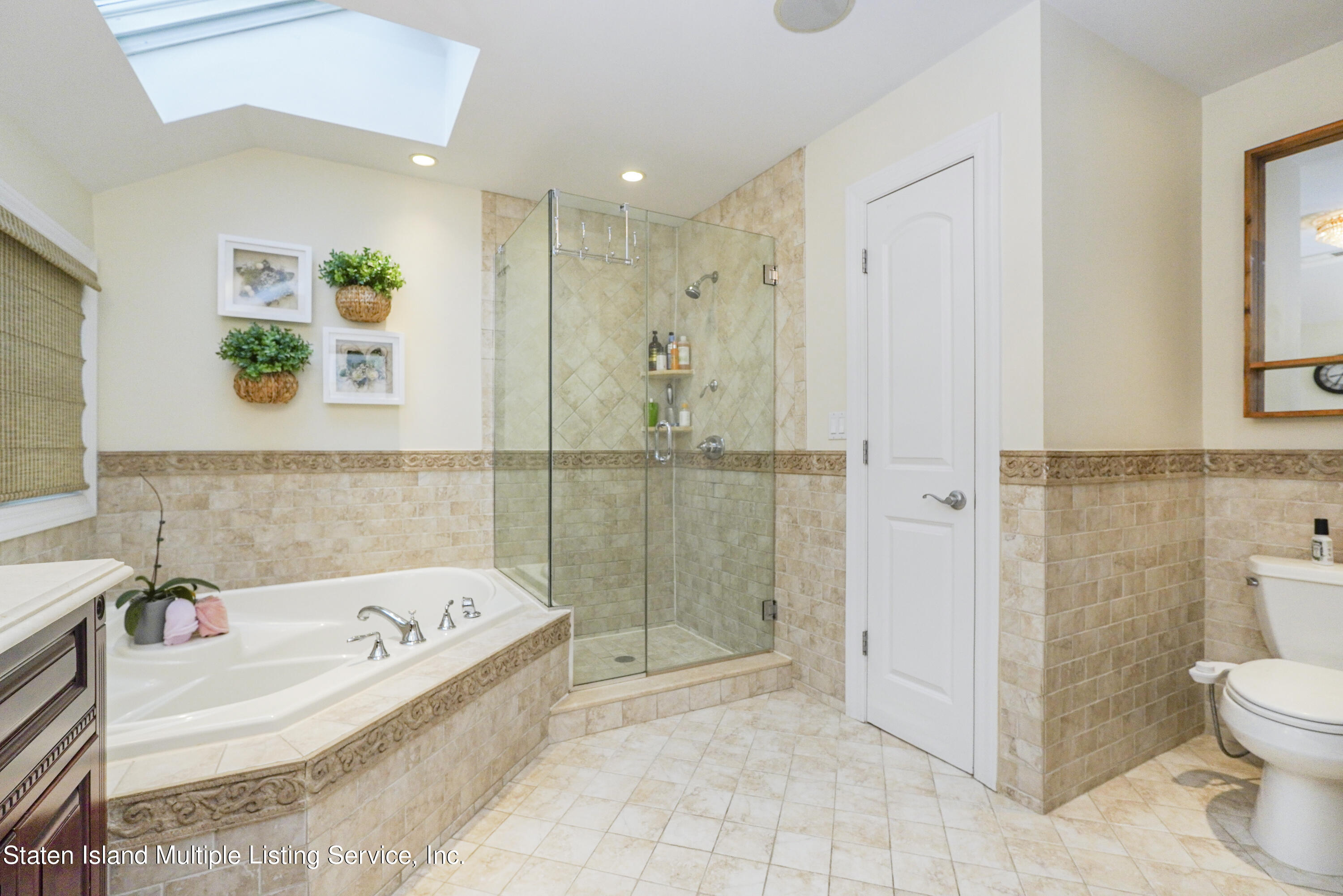 20 Kenneth Place Staten Island, NY 10309 - Photo 32 of 52 a bathroom with a bathtub and a shower