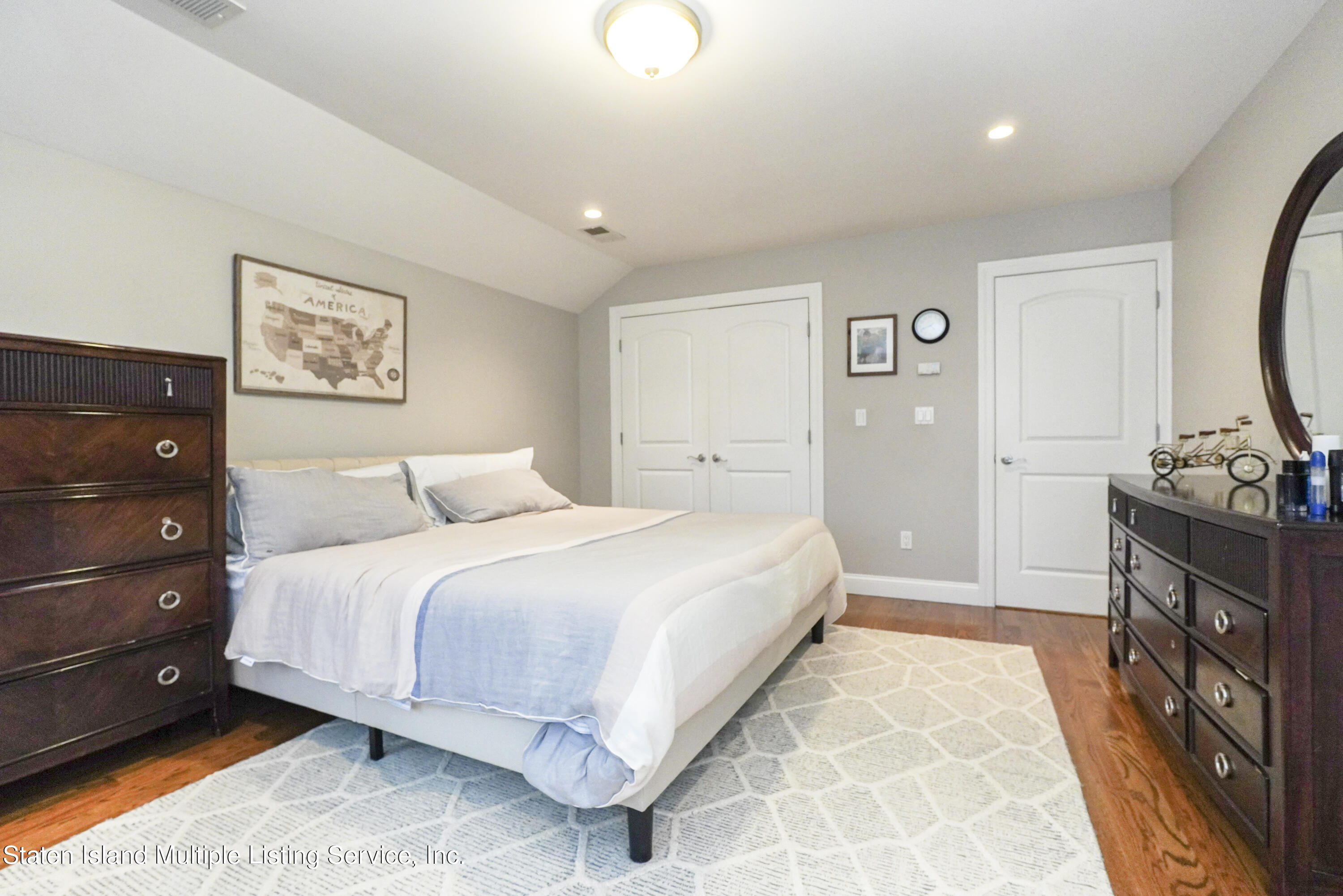 20 Kenneth Place Staten Island, NY 10309 - Photo 33 of 52 a spacious bedroom with a bed and a dresser