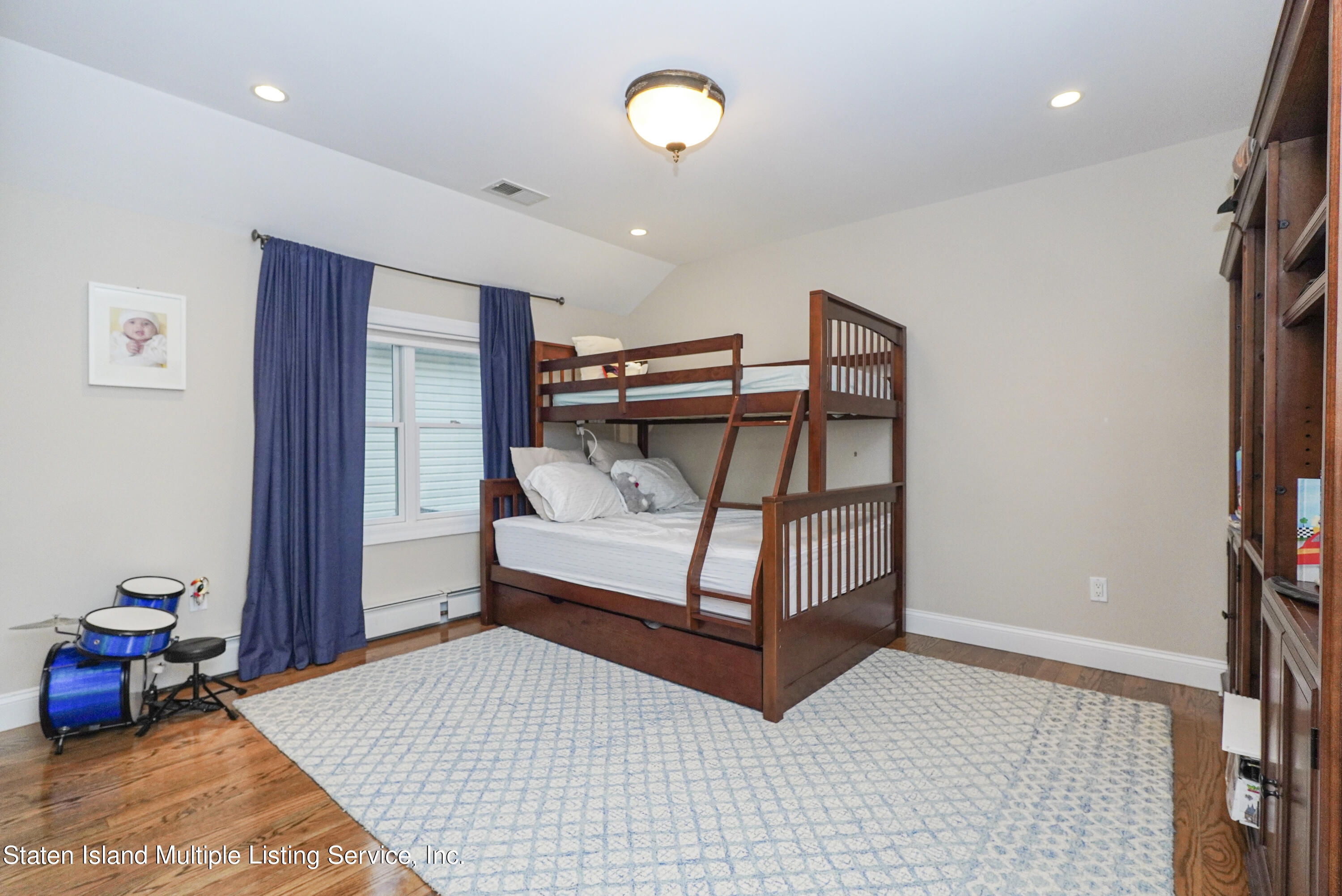 20 Kenneth Place Staten Island, NY 10309 - Photo 36 of 52 a bedroom with furniture and a window