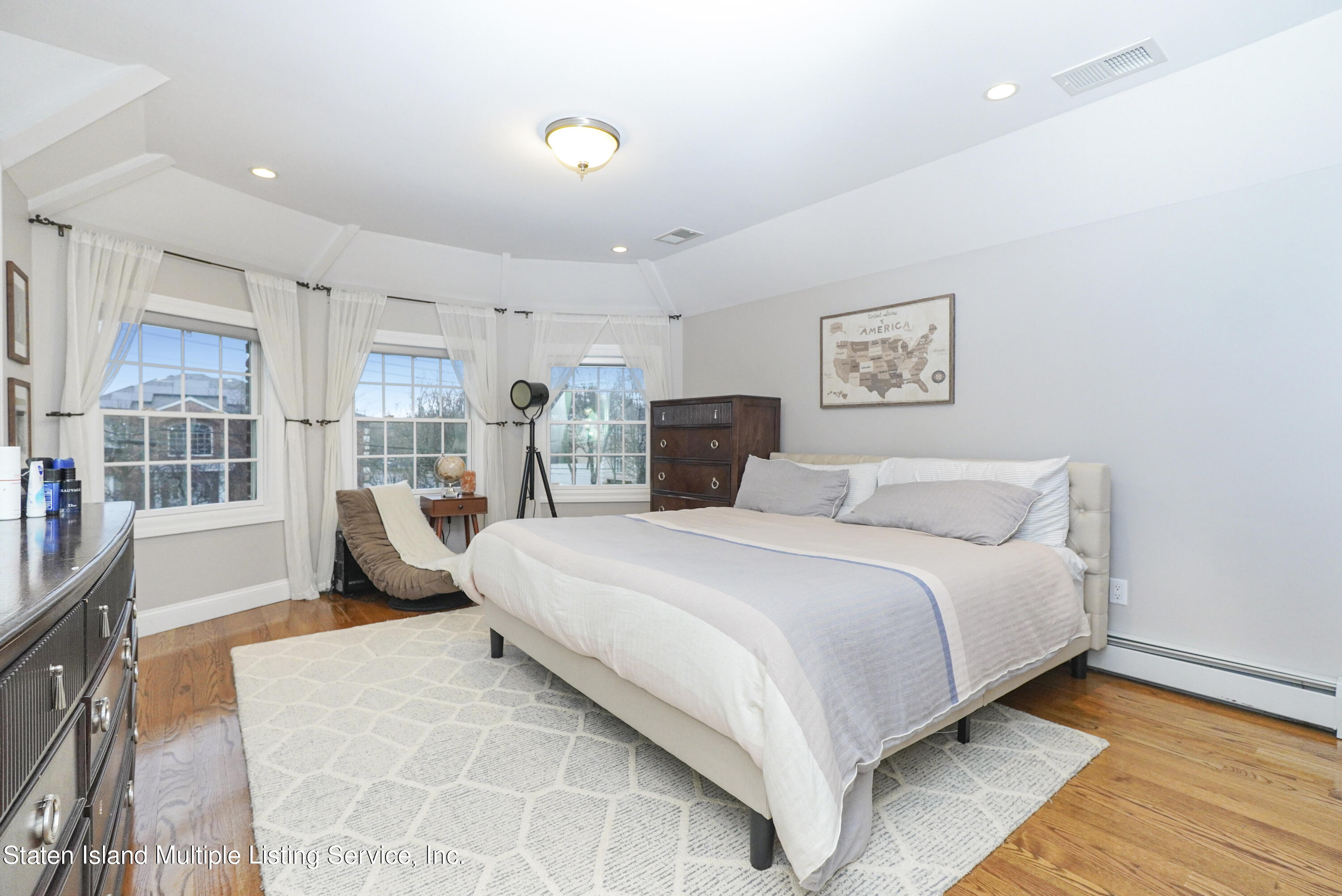 20 Kenneth Place Staten Island, NY 10309 - Photo 37 of 52 a bedroom with a large bed and a large window