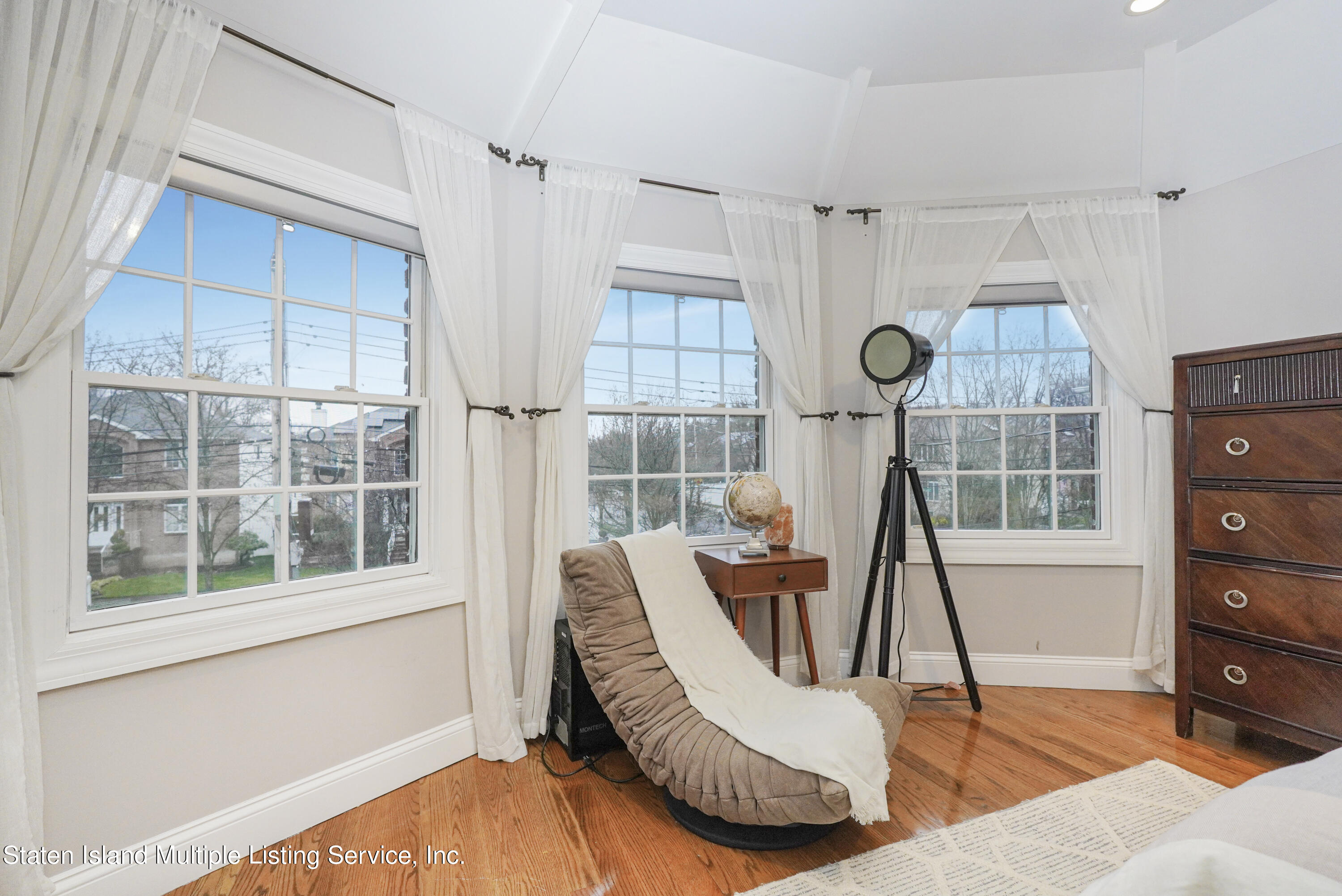 20 Kenneth Place Staten Island, NY 10309 - Photo 38 of 52 a view of a living room with a floor to ceiling window and wooden floor