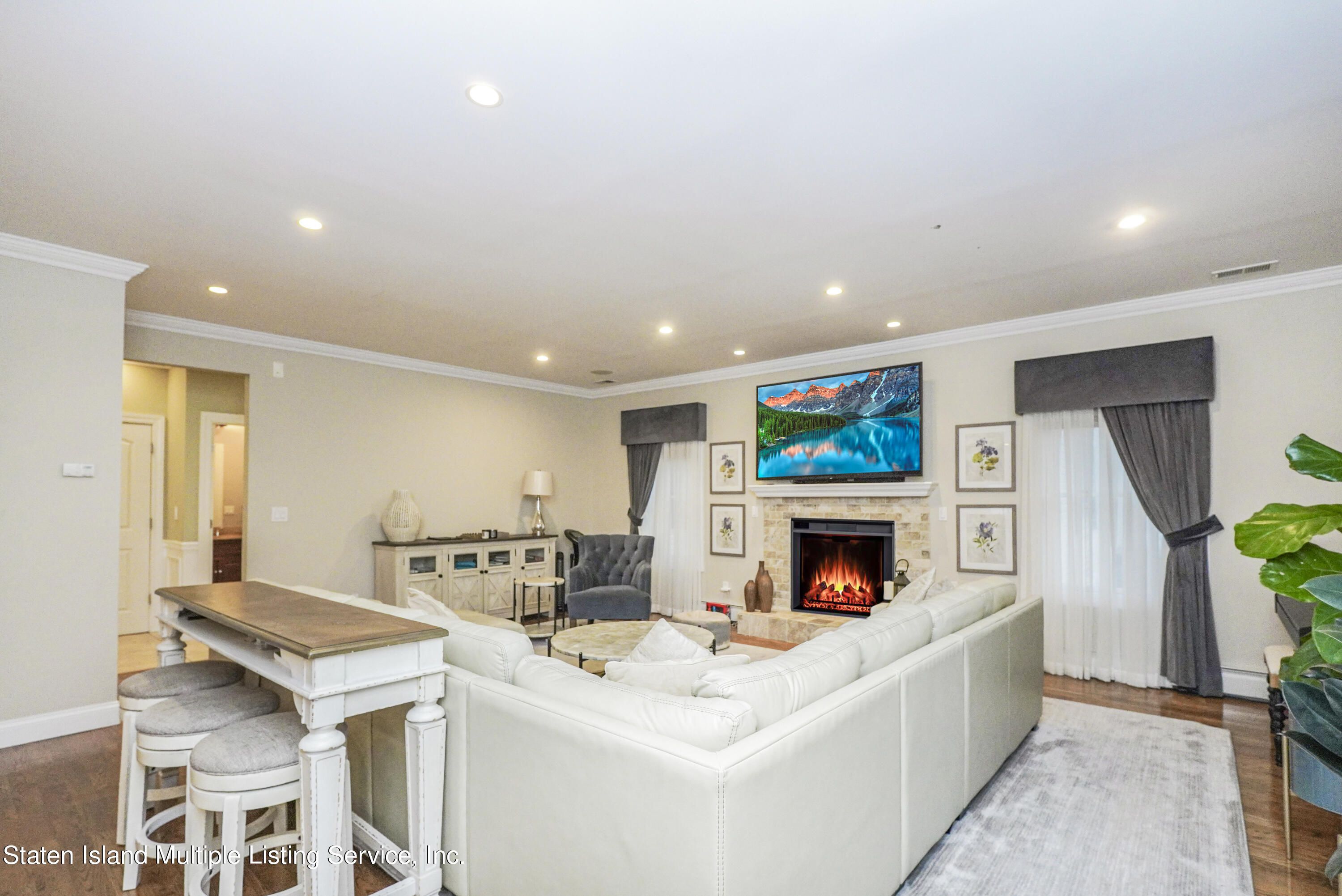 20 Kenneth Place Staten Island, NY 10309 - Photo 40 of 52 a living room with fireplace furniture and a flat screen tv