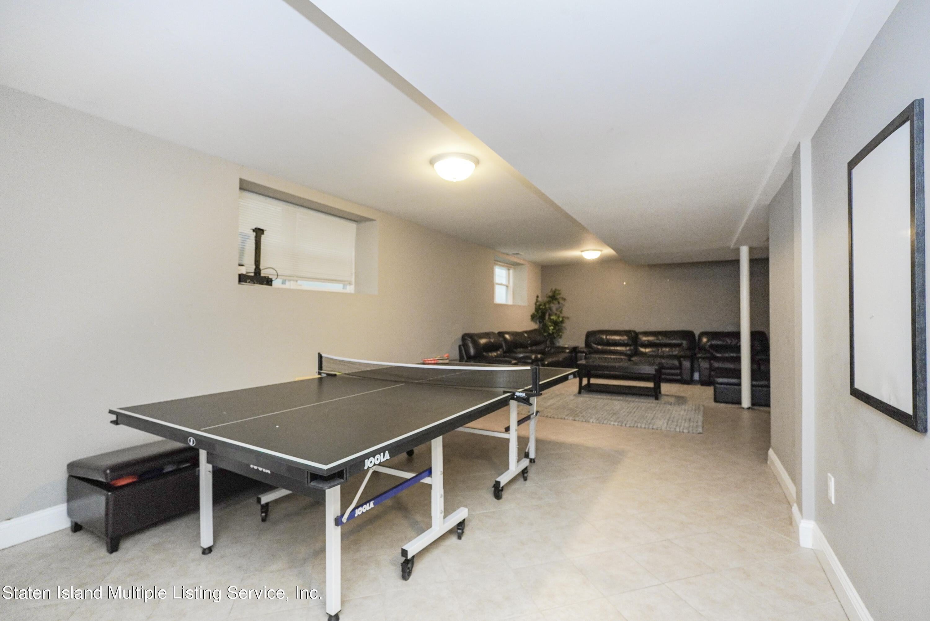 20 Kenneth Place Staten Island, NY 10309 - Photo 41 of 52 a room with furniture and a table