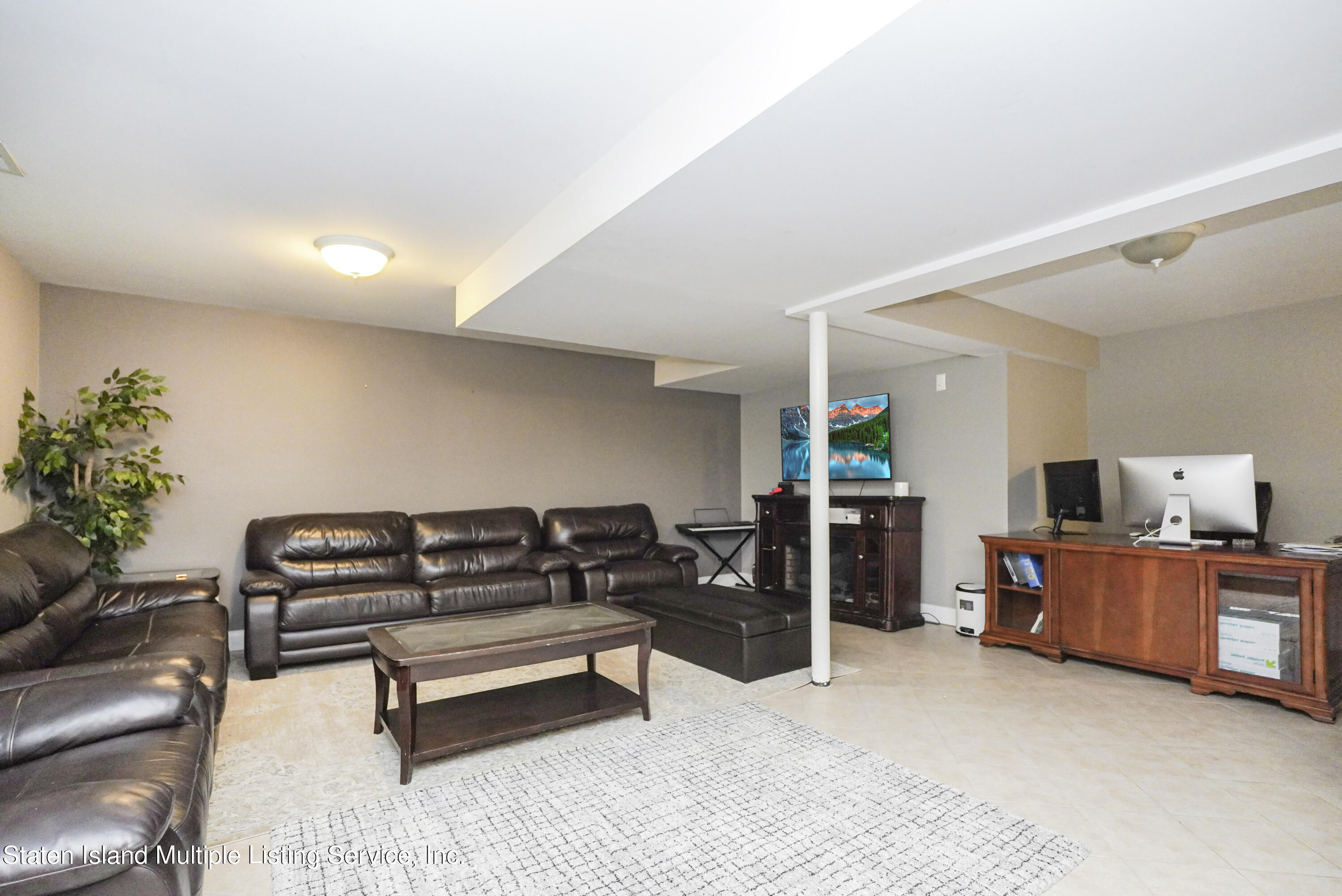 20 Kenneth Place Staten Island, NY 10309 - Photo 42 of 52 a living room with furniture and a flat screen tv