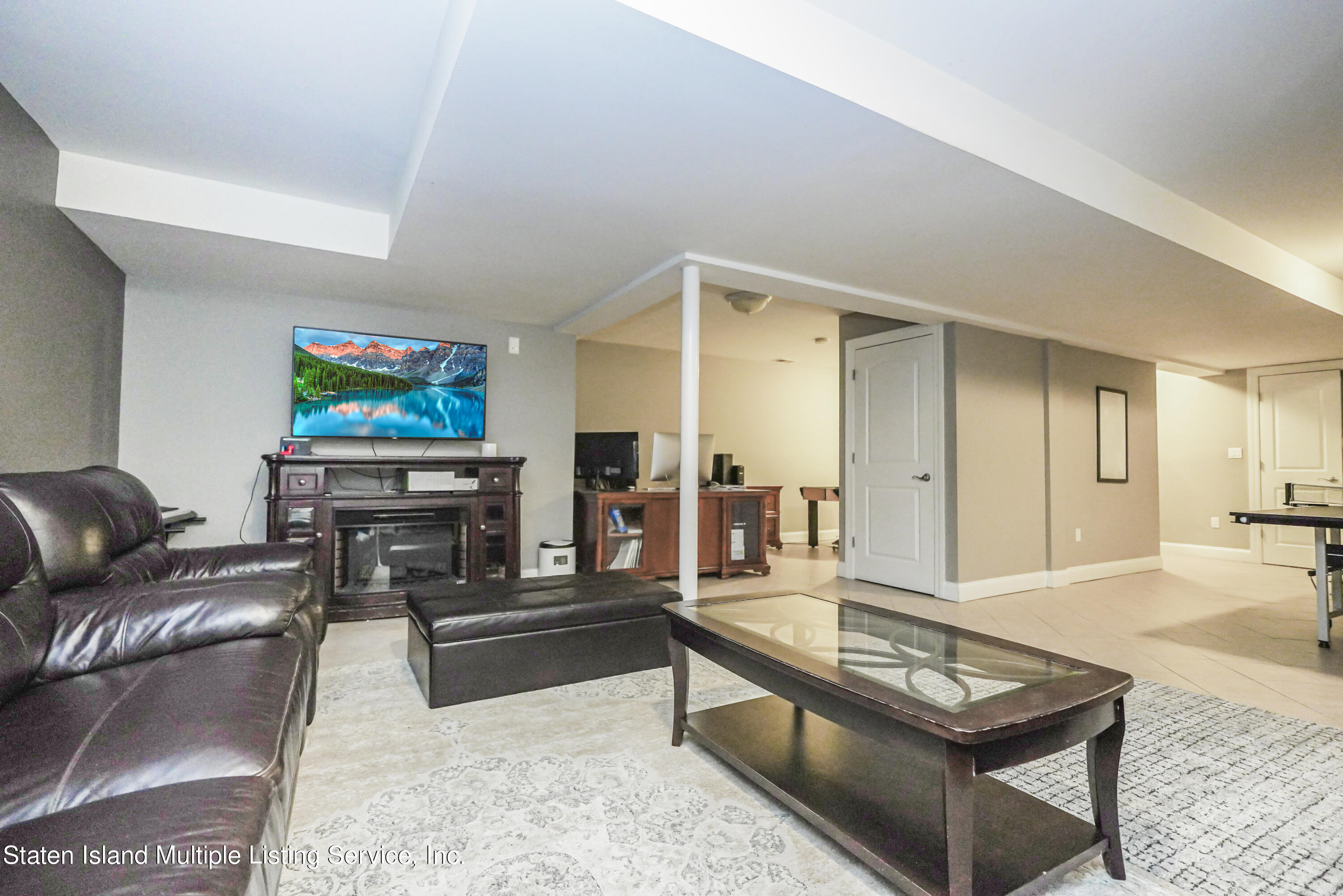 20 Kenneth Place Staten Island, NY 10309 - Photo 43 of 52 a living room with furniture and a flat screen tv