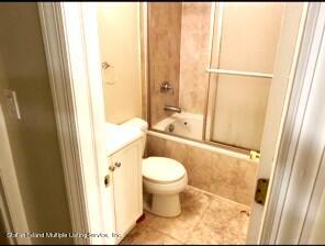 20 Kenneth Place Staten Island, NY 10309 - Photo 46 of 52 a bathroom with a granite countertop toilet and a sink