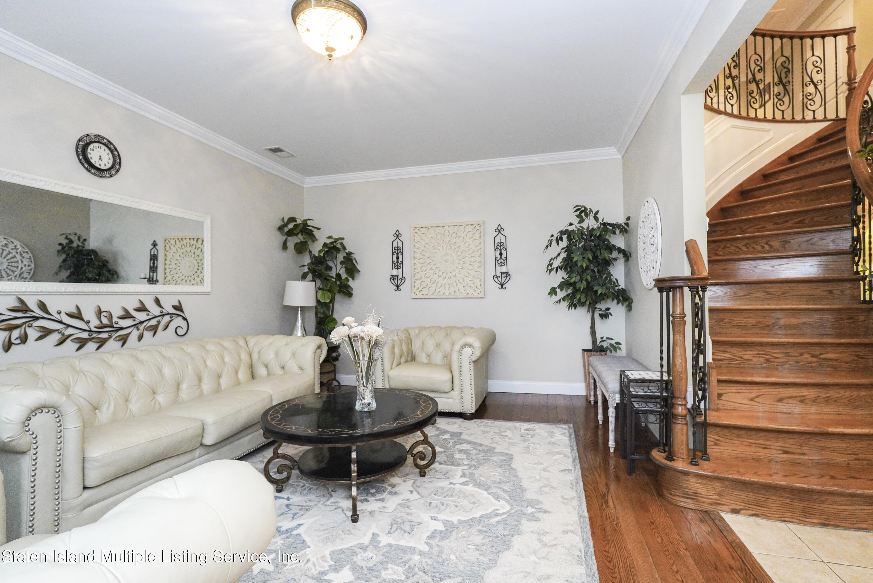 20 Kenneth Place Staten Island, NY 10309 - Photo 8 of 52 a living room with furniture and wooden floor